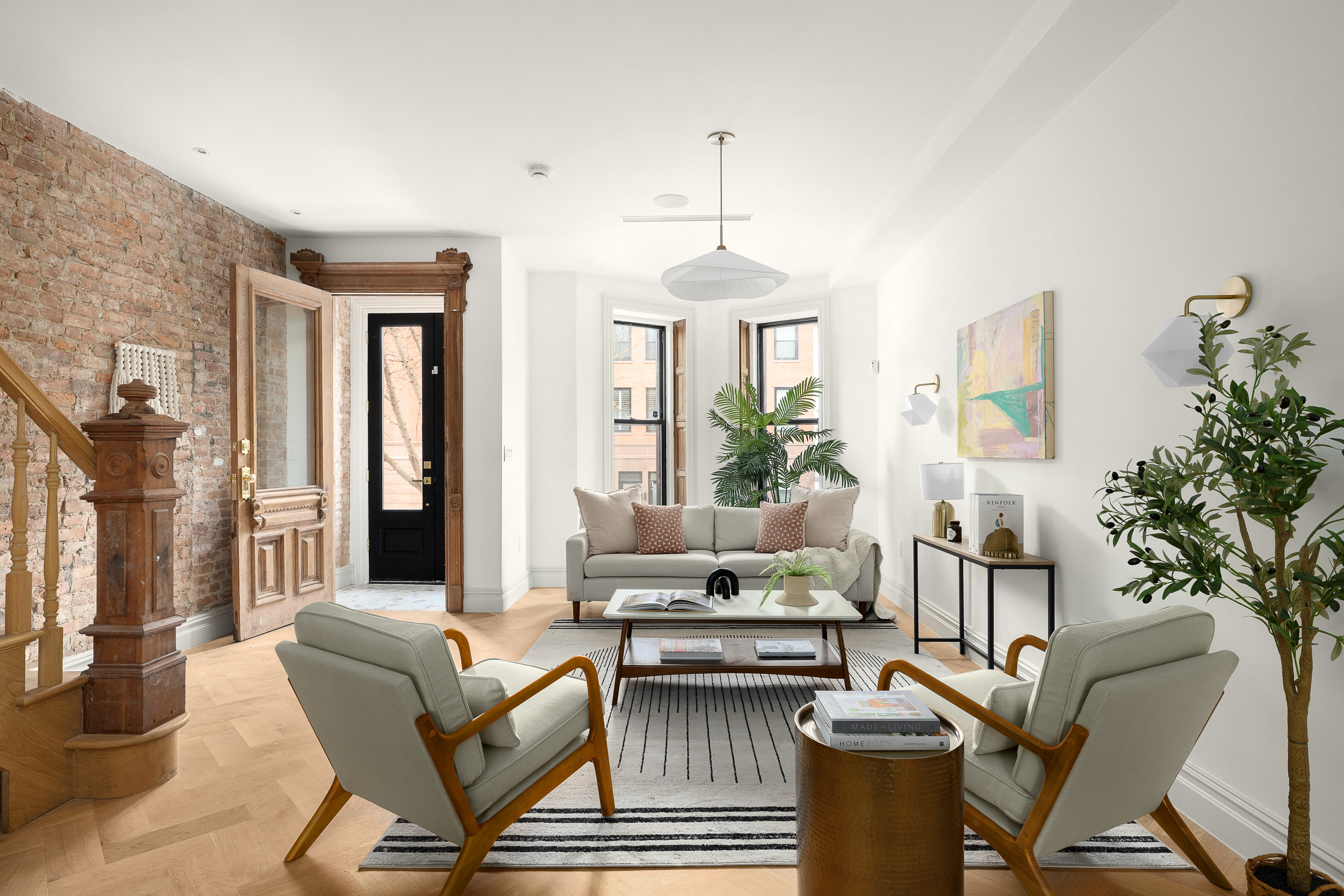 485 Halsey Street Brooklyn, NY 11233 - Photo 1 of 17 a living room with furniture a window and a chandelier