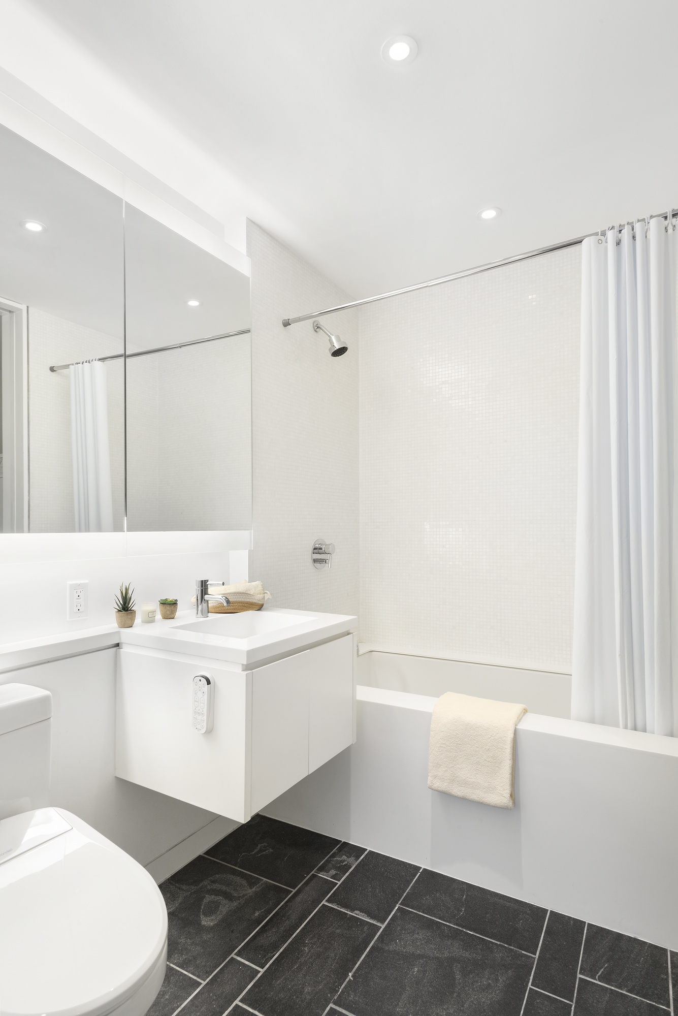 1 Grand Army Plaza, Unit 9D Brooklyn, NY 11238 - Photo 10 of 20 a bathroom with a sink a toilet and a bathtub