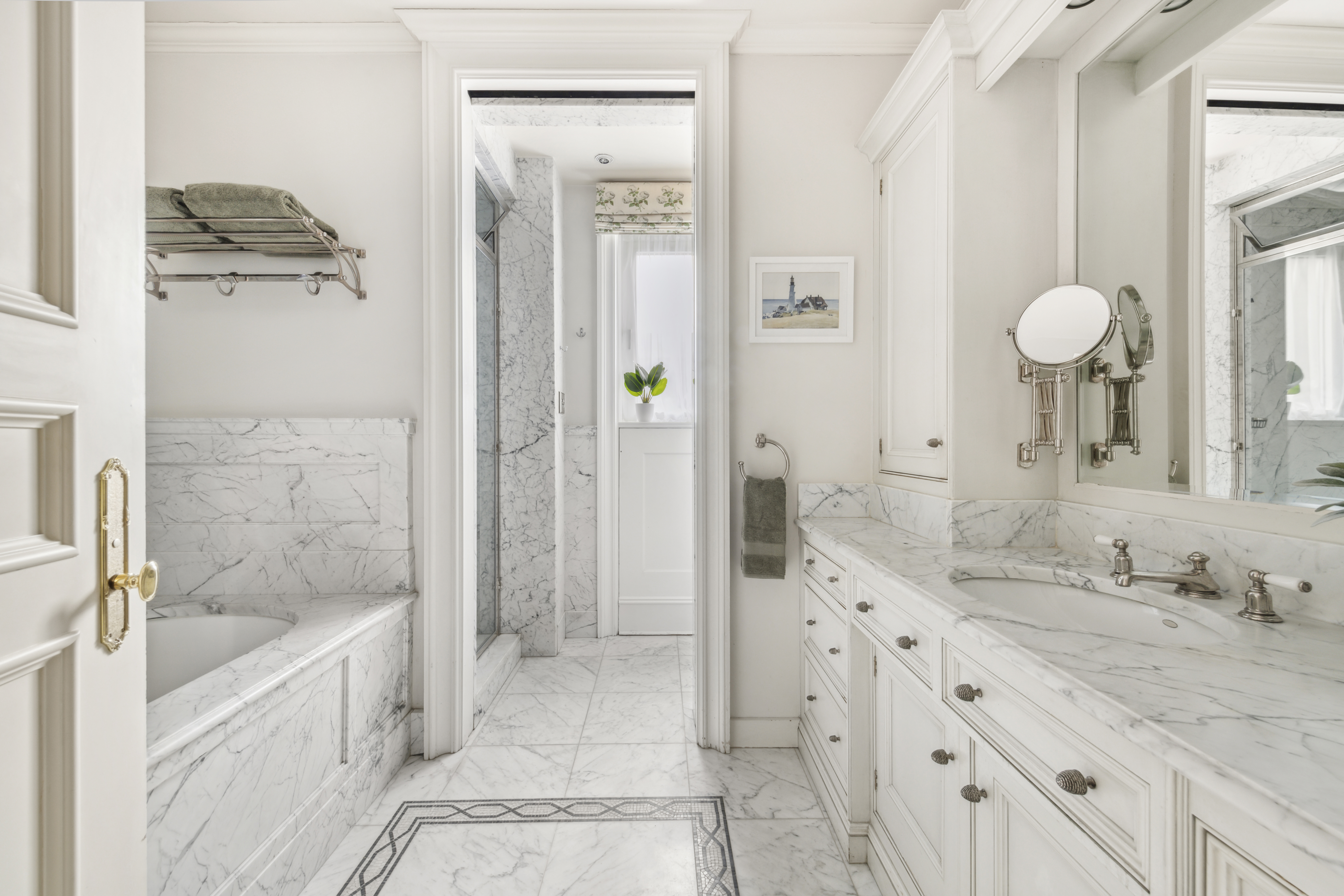 67 Riverside Drive, Unit 1A Manhattan, NY 10024 - Photo 8 of 18 a bathroom with a granite countertop sink a mirror a bathtub and shower