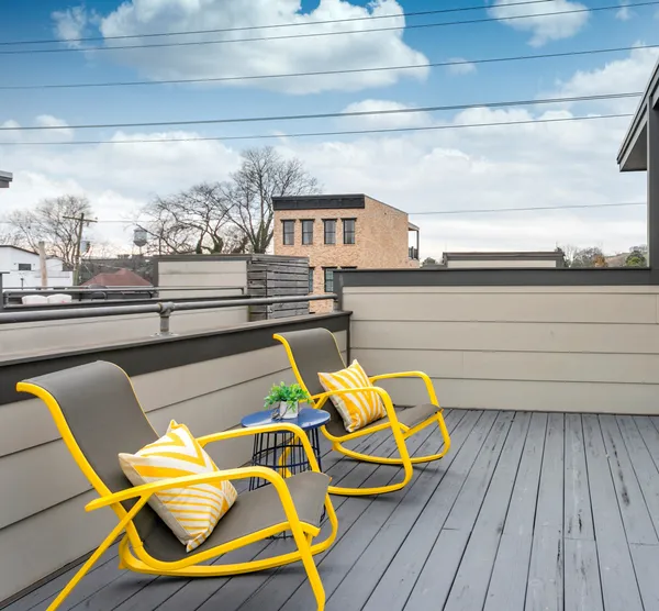 a view of a balcony with chairs