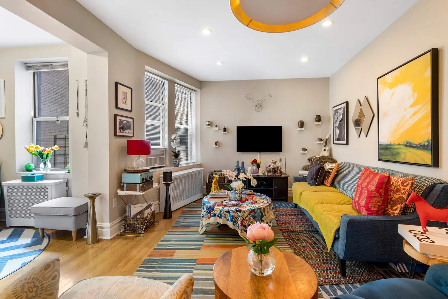 a living room with furniture and a flat screen tv