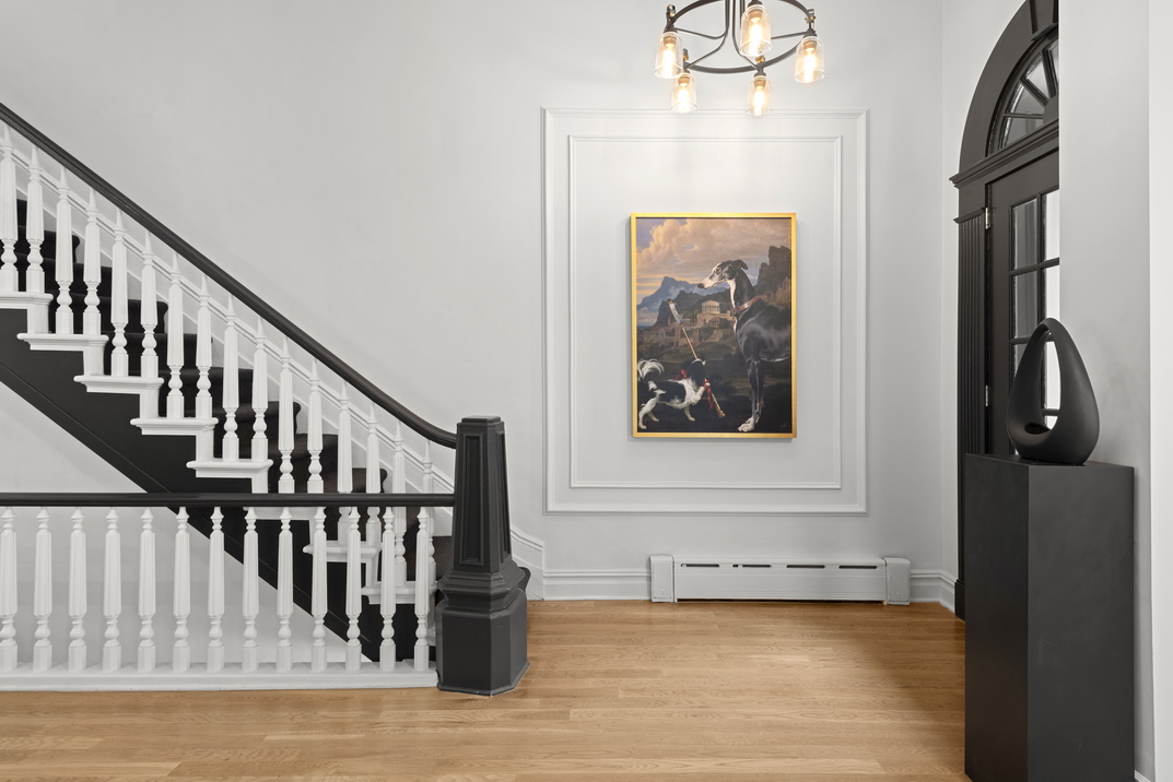 209 East 61st Street Manhattan, NY 10065 - Photo 6 of 24 a view of entryway with wooden floor
