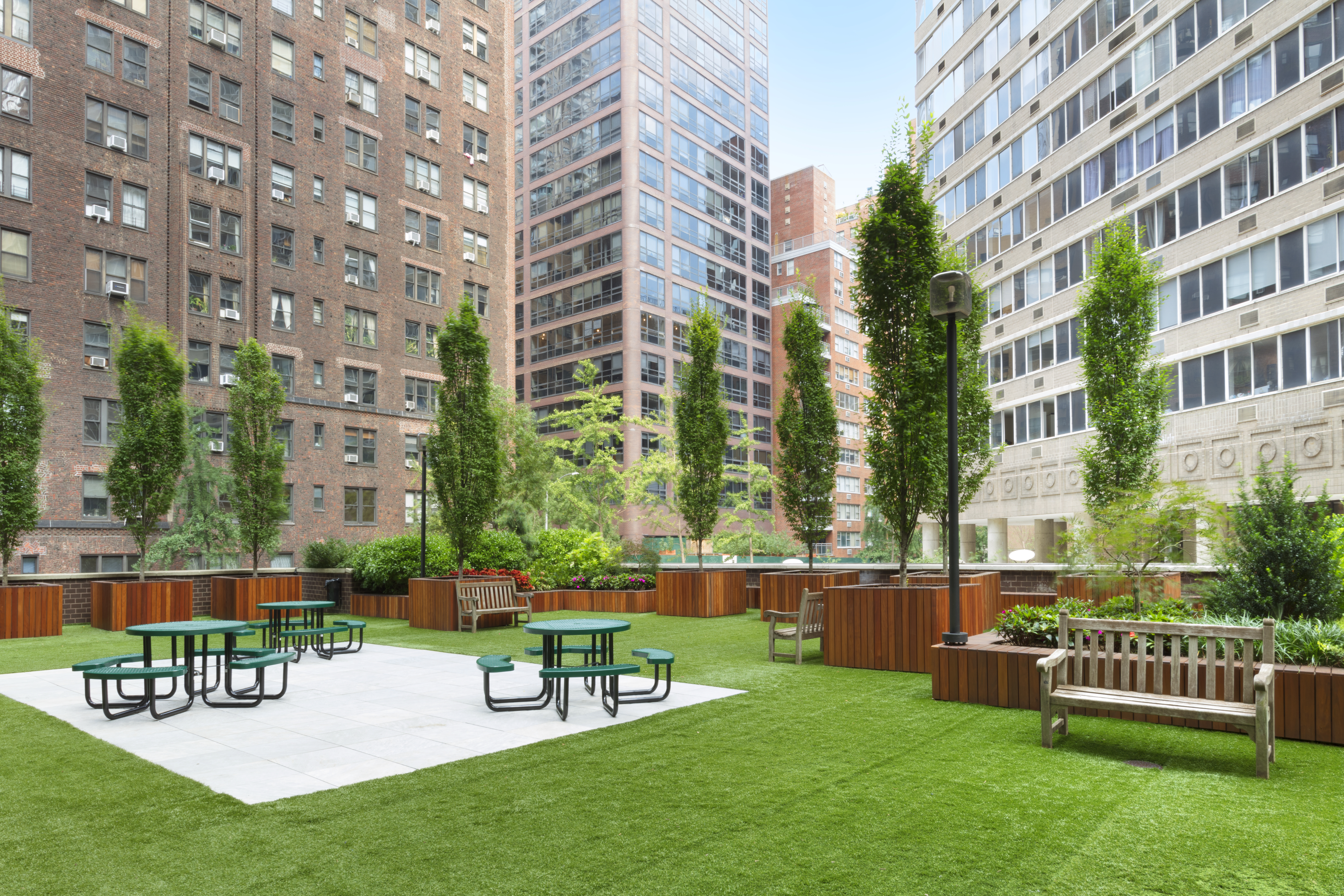 400 East 54th Street, Unit 8A Manhattan, NY 10022 - Photo 16 of 20 a view of a chairs and table in the back yard of the house