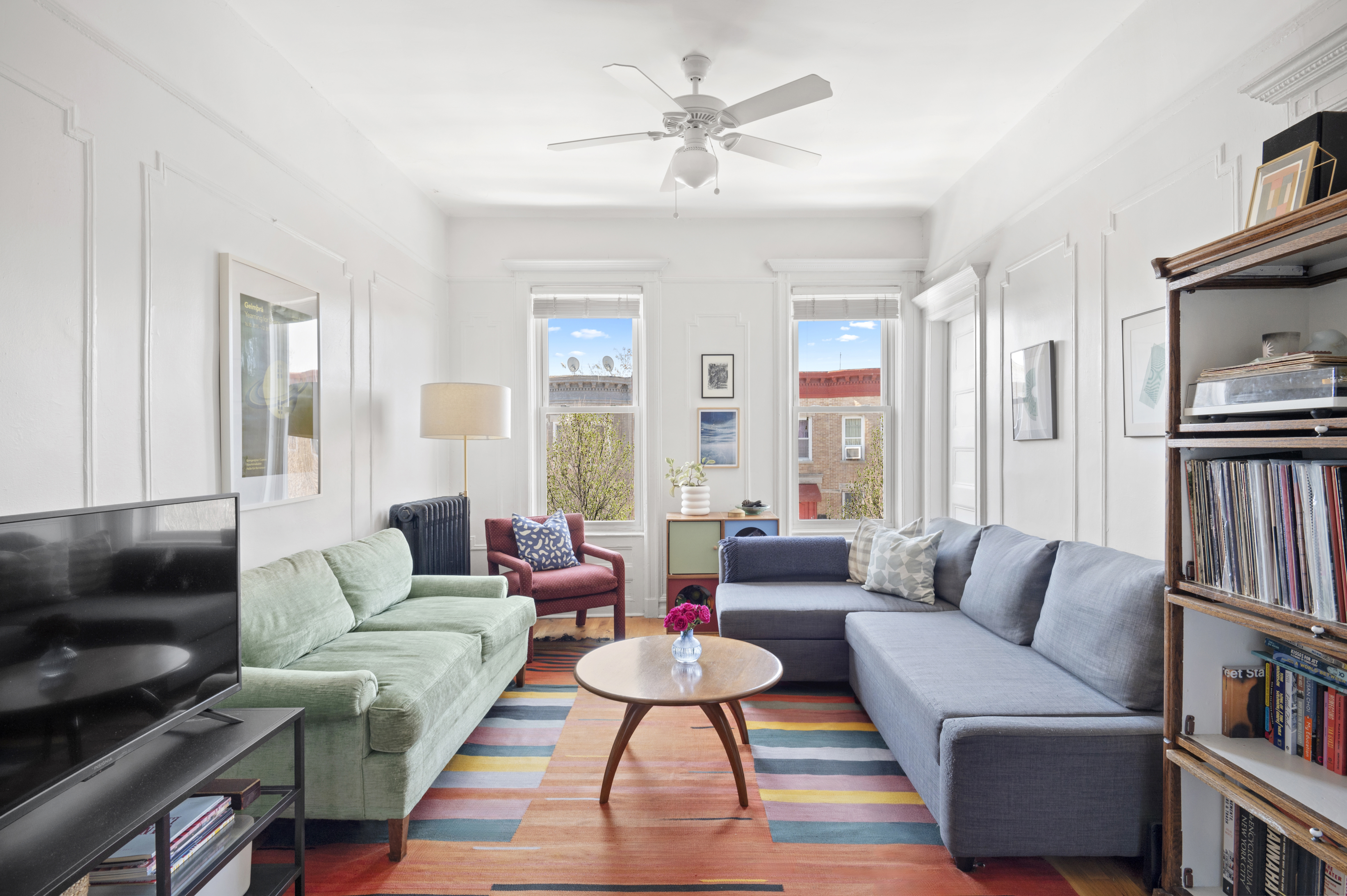 185 East 31st Street Brooklyn, NY 11226 - Photo 15 of 23 a living room with furniture and a book shelf
