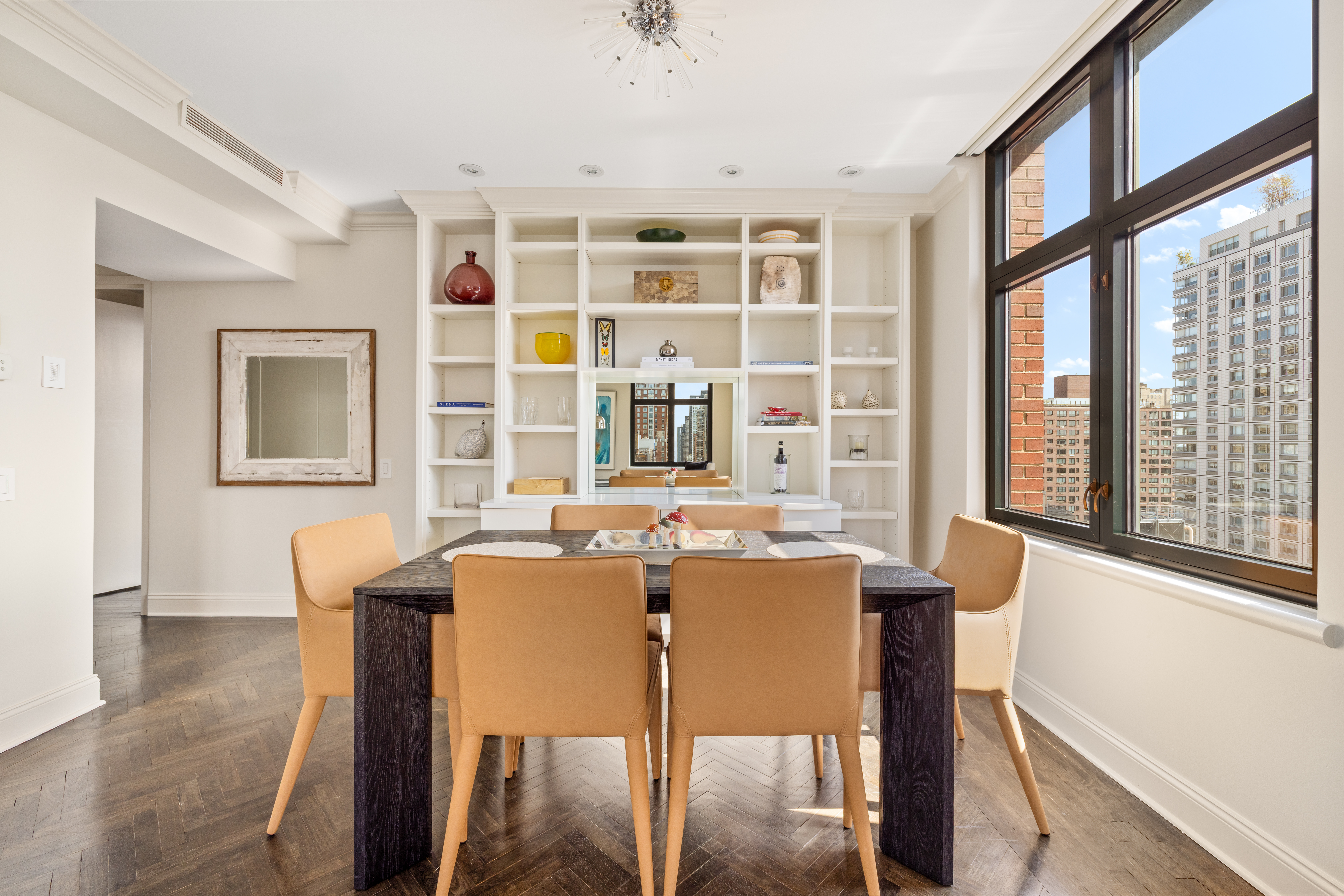 188 East 70th Street, Unit 22A Manhattan, NY 10021 - Photo 2 of 17 a view of a dining room with furniture window and wooden floor