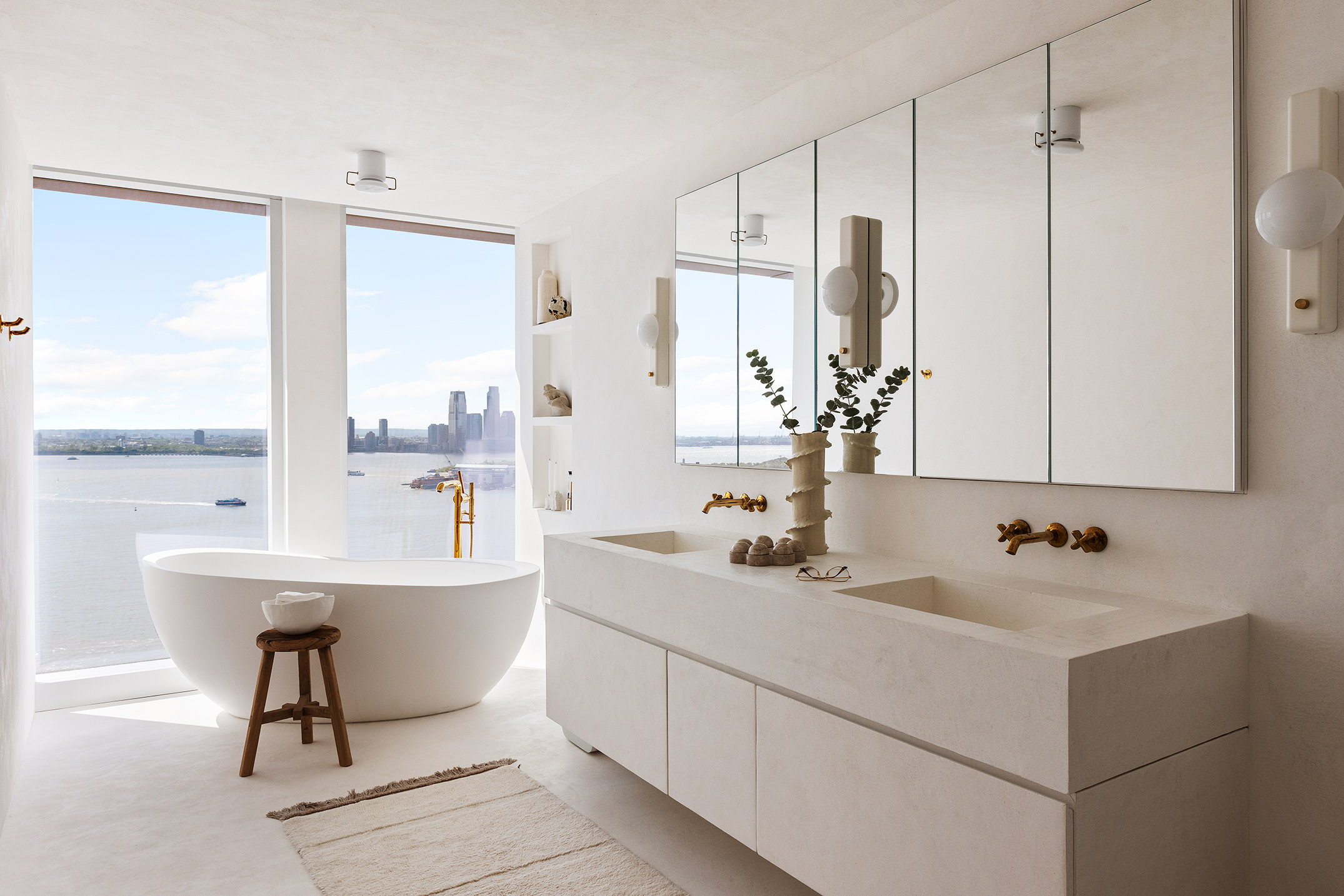 50 Bridge Park Drive, Unit 26A Brooklyn, NY 11201 - Photo 17 of 29 a bathroom with a double vanity sink a mirror and a bathtub