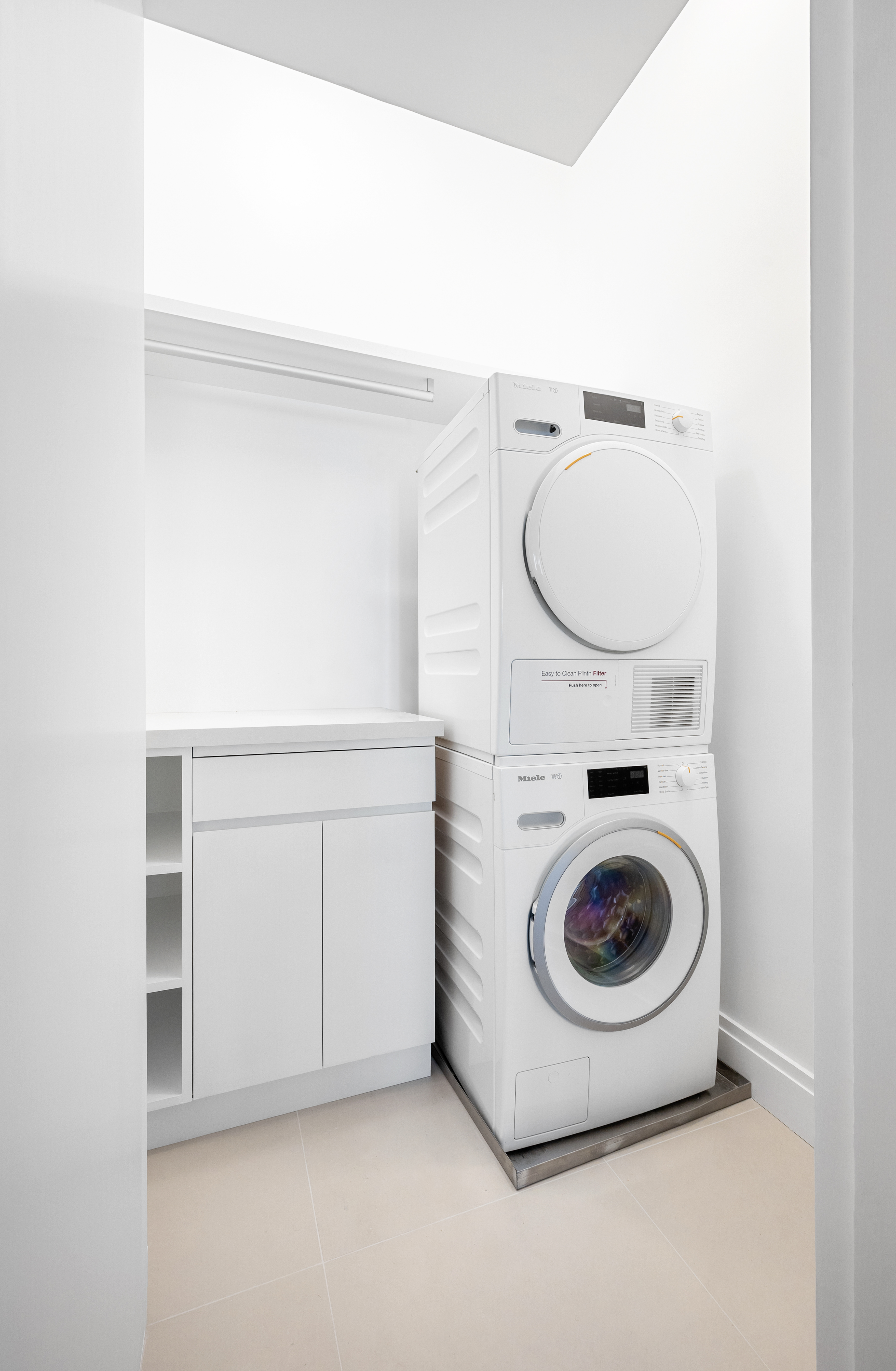 69 Bank Street, Unit 203 Manhattan, NY 10014 - Photo 20 of 23 a utility room with dryer and washer