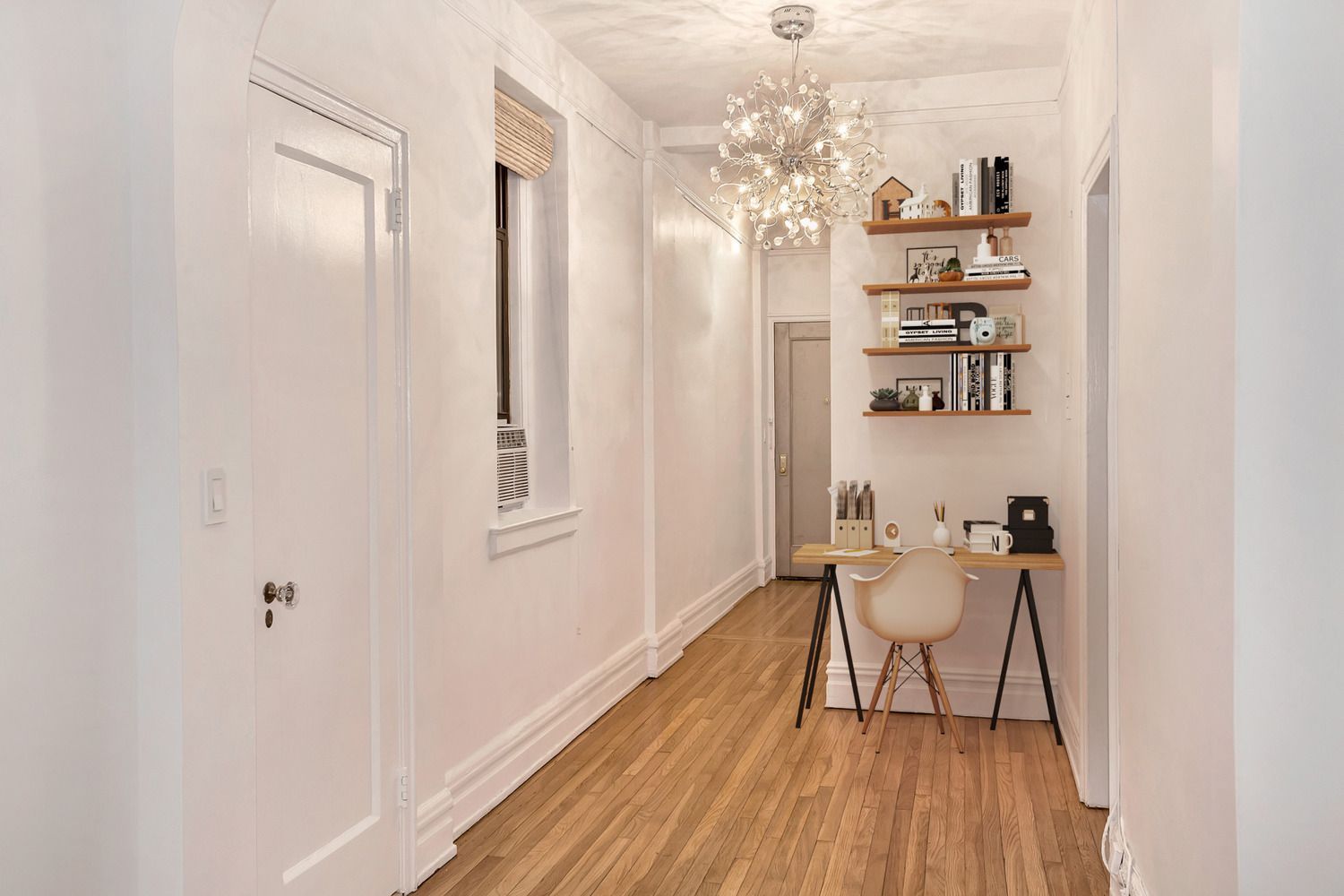 205 West 54th Street, Unit 2E Manhattan, NY 10019 - Photo 3 of 11 a dining room with furniture and chandelier