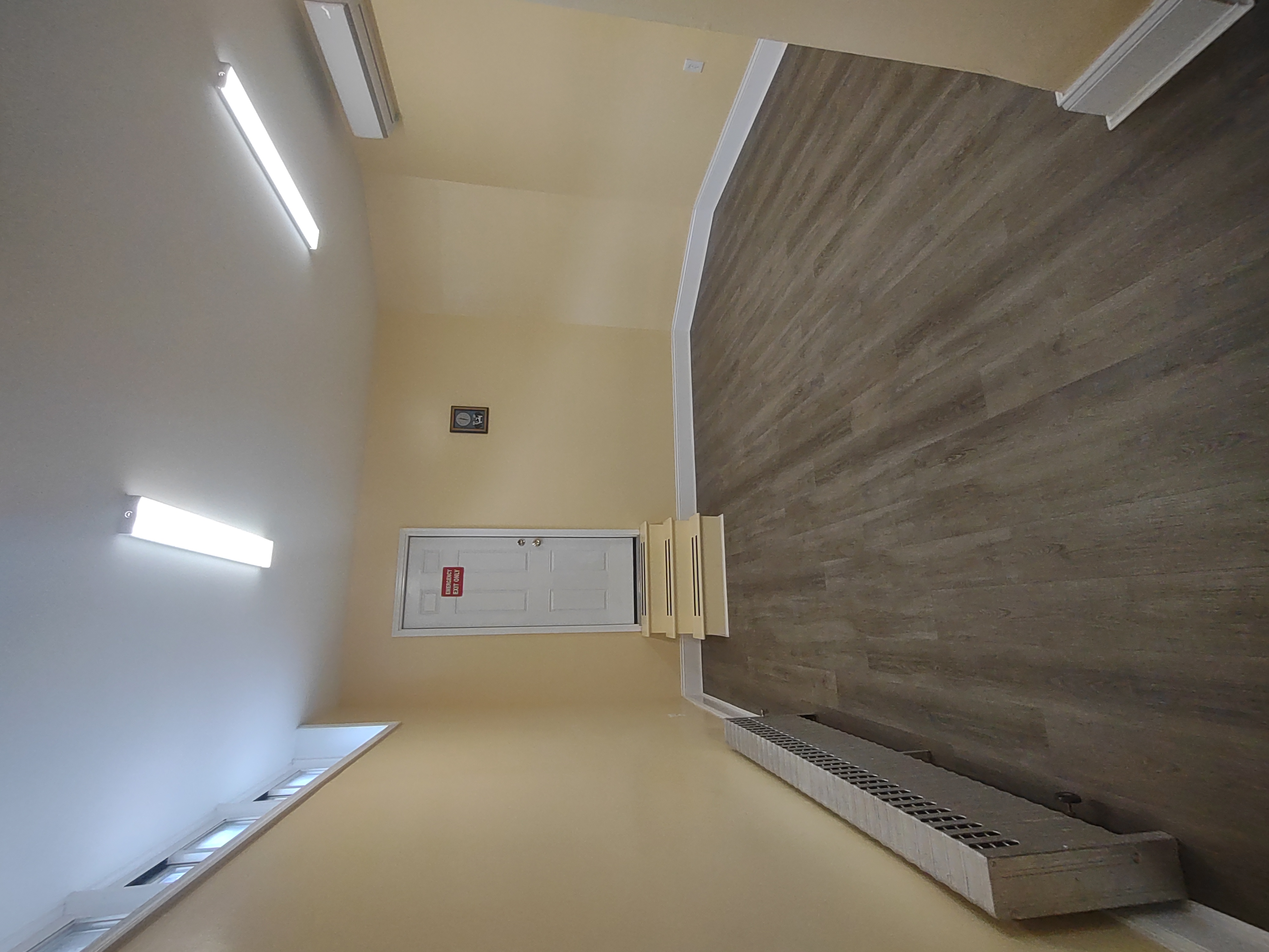 175 Fenimore Street Brooklyn, NY 11225 - Photo 10 of 11 an empty room with wooden floor and windows