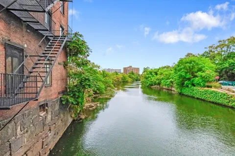a view of a lake with a building in the background