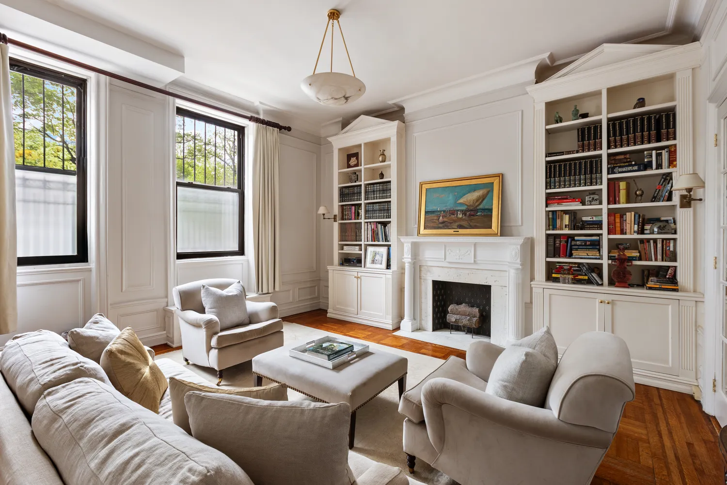 a living room with furniture fireplace and window