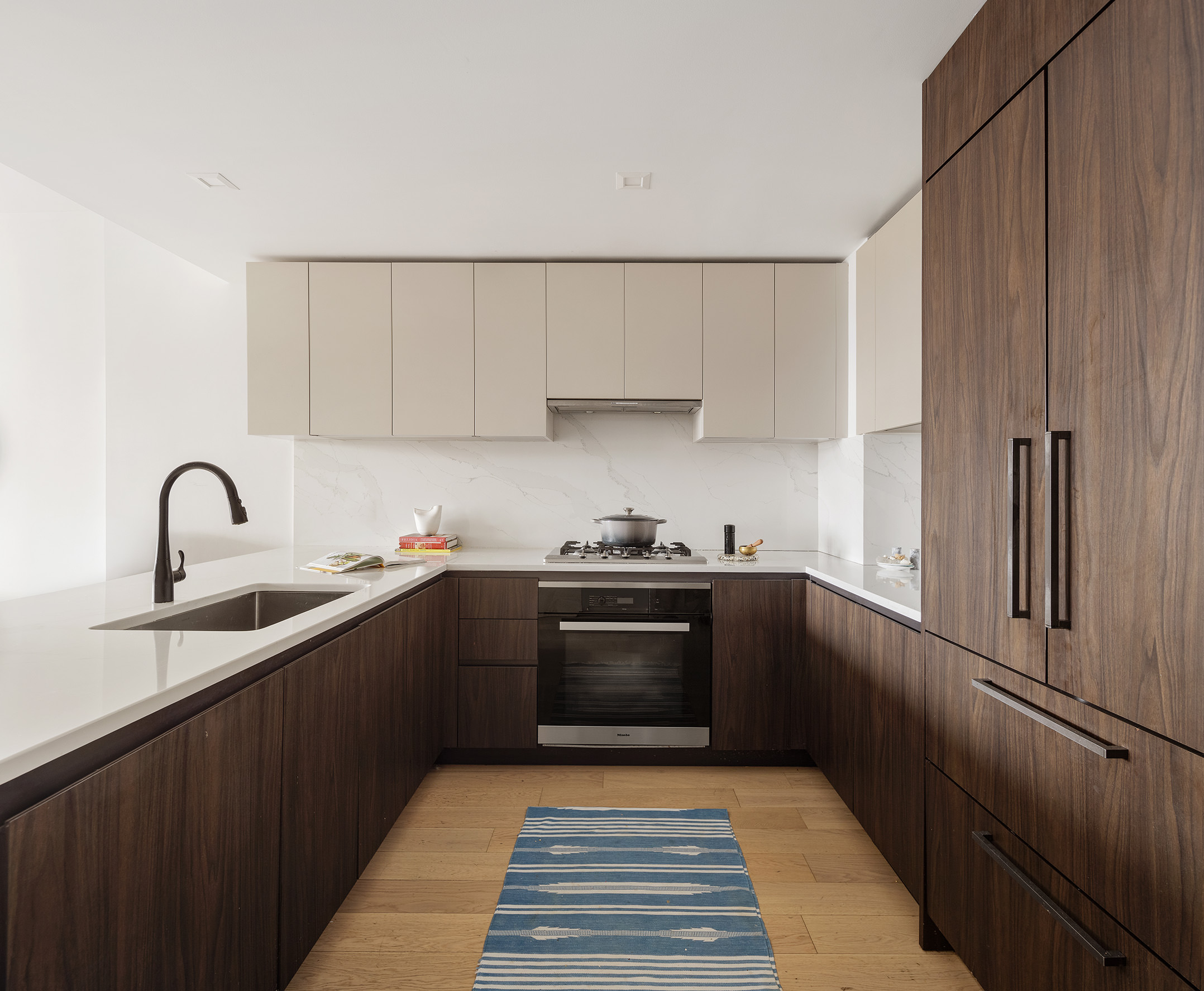 11 Hancock Place, Unit PH102 Manhattan, NY 10027 - Photo 4 of 18 a kitchen with stainless steel appliances granite countertop a sink stove and refrigerator