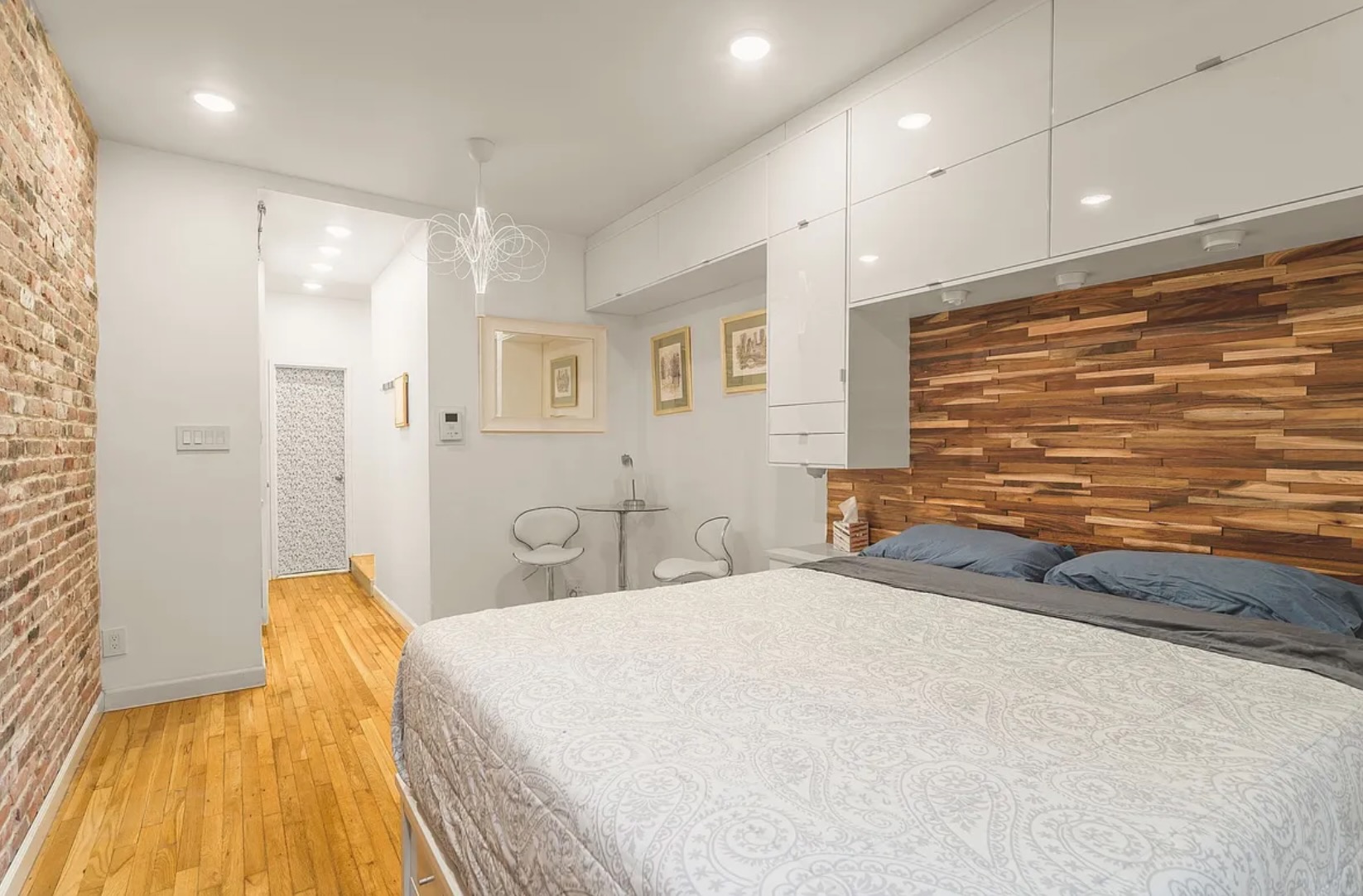 430 East 87th Street, Unit 2A Manhattan, NY 10128 - Photo 4 of 8 a bed room with a bed and a couch