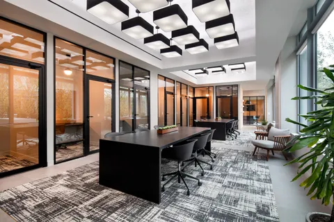 a living room filled with furniture and a table