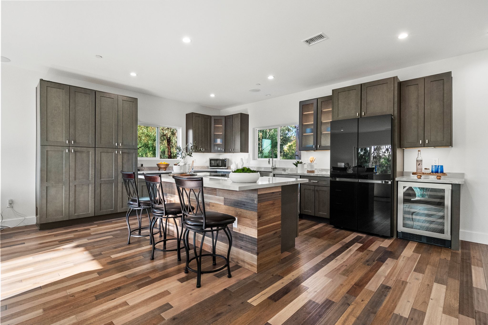 Dove Hollow Road Encinitas, CA 92024 - Photo 13 of 16 a kitchen with a table chairs refrigerator and cabinets