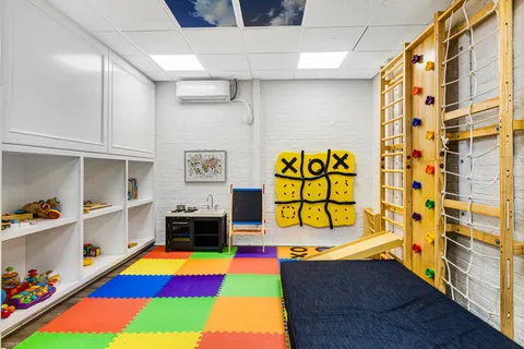 a room with toys and wall space