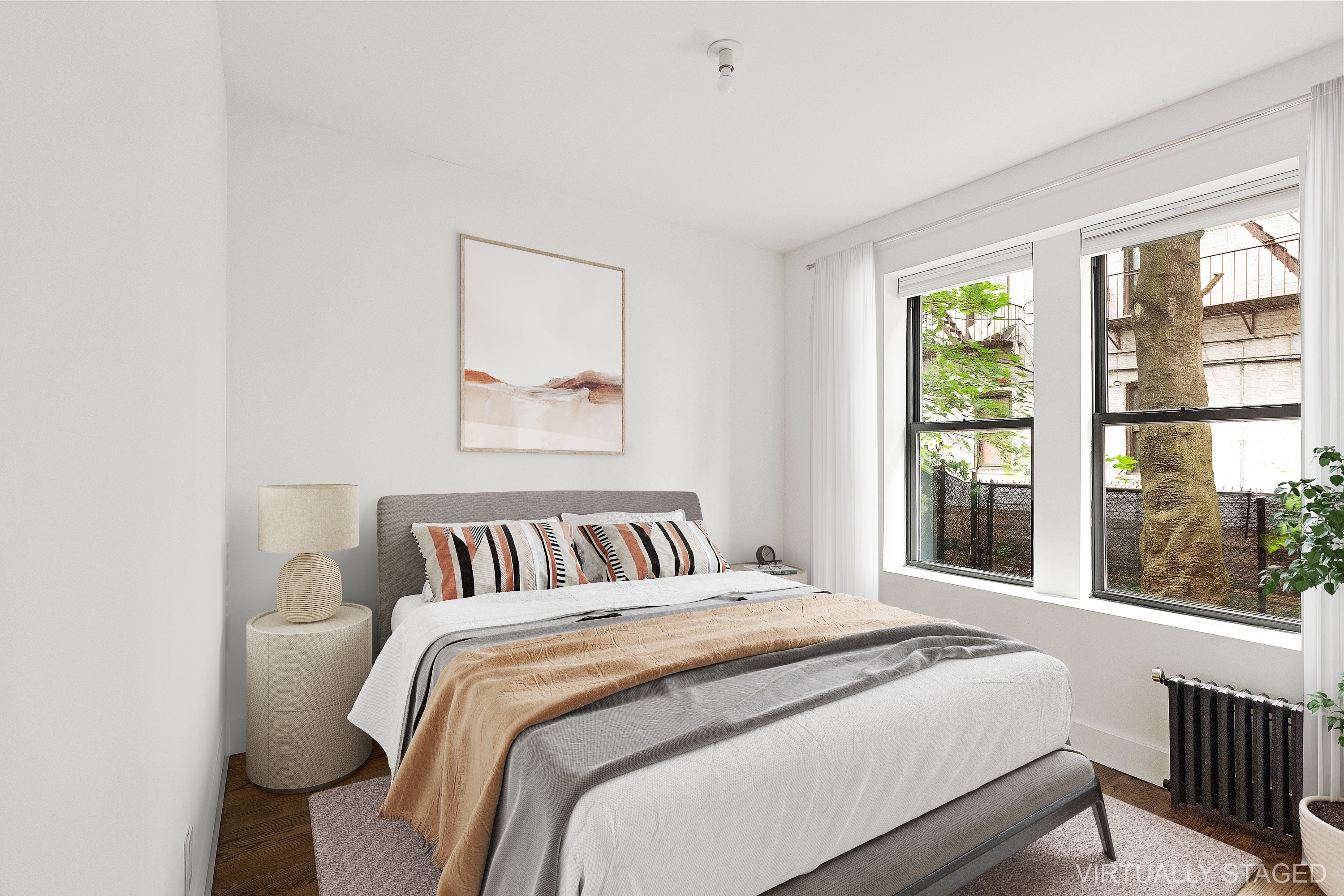 35 Clarkson Avenue, Unit A4 Brooklyn, NY 11226 - Photo 5 of 7 a bedroom with a large bed and a large window