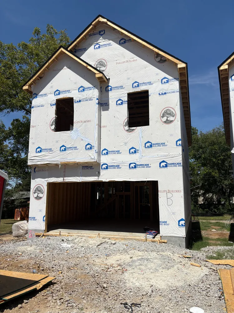 a front view of a house with large windows