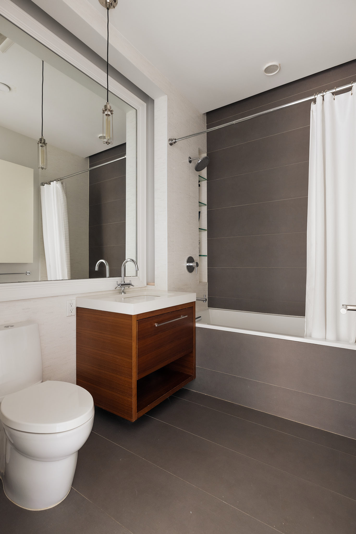 170 South 1st Street, Unit 4B Brooklyn, NY 11211 - Photo 9 of 11 a bathroom with a bathtub toilet sink and mirror