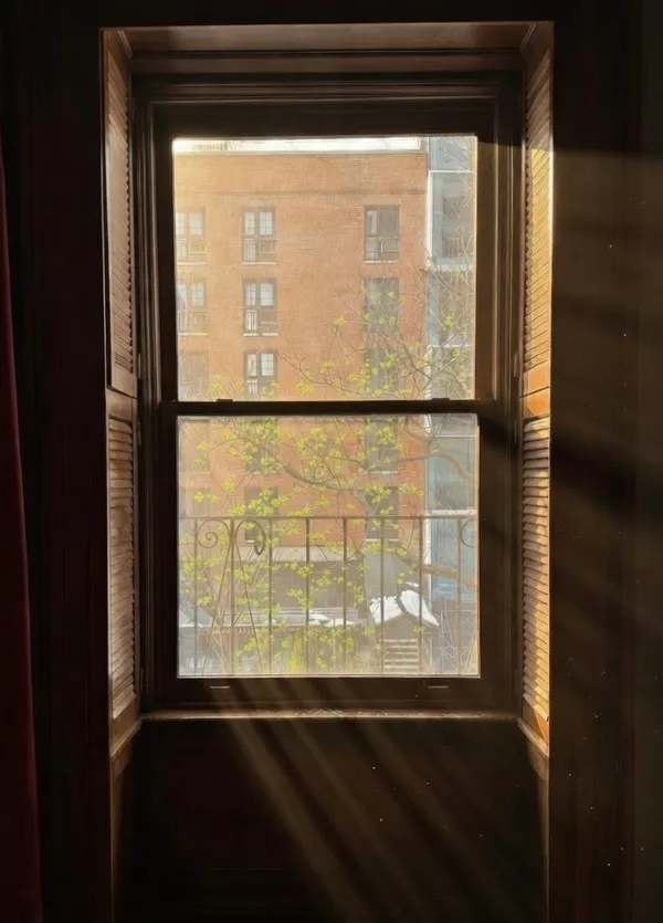 a view of an empty room with a window