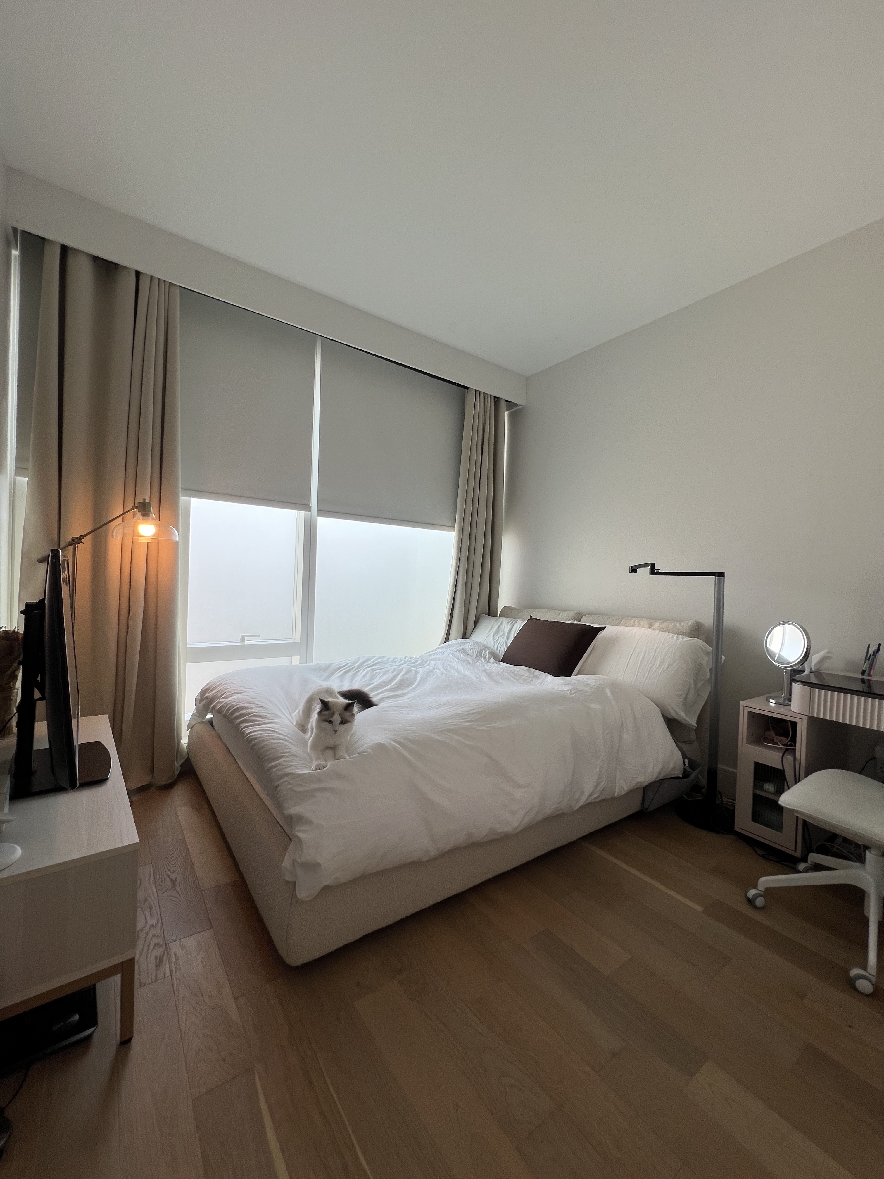 a bedroom with a bed and a couch