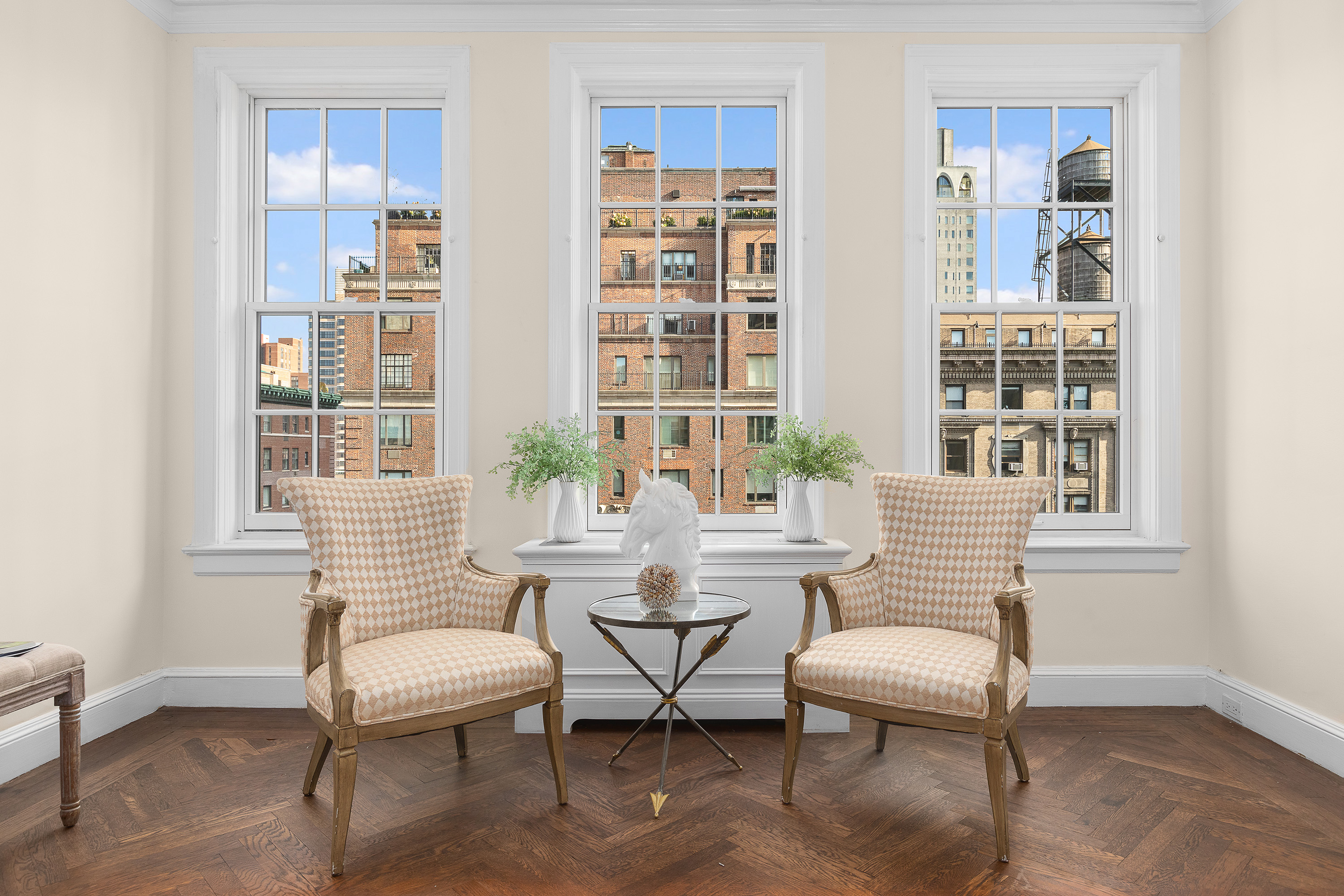 1088 Park Avenue, Unit 15C Manhattan, NY 10128 - Photo 3 of 26 a living room with furniture and windows