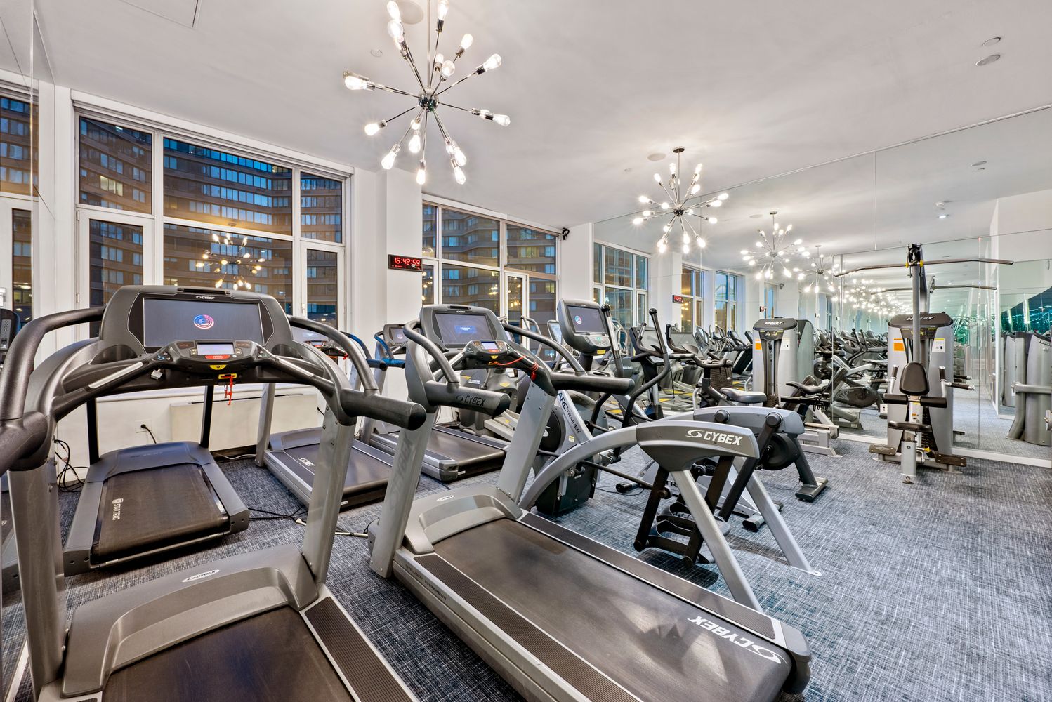 635 West 42nd Street, Unit 23E Manhattan, NY 10036 - Photo 12 of 16 a view of a room with gym equipment