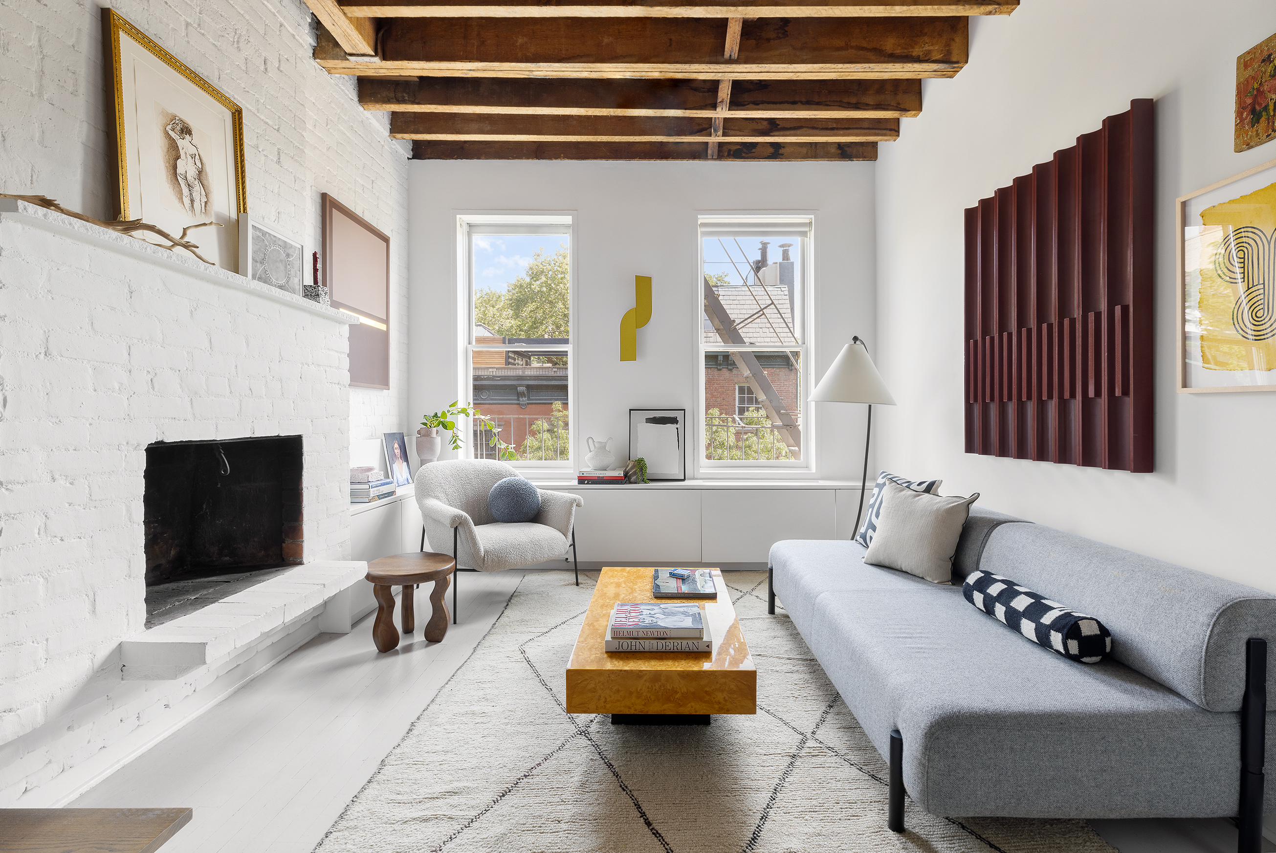 281 West 11th Street, Unit 4/5C Manhattan, NY 10014 - Photo 2 of 18 a living room with furniture and a fireplace