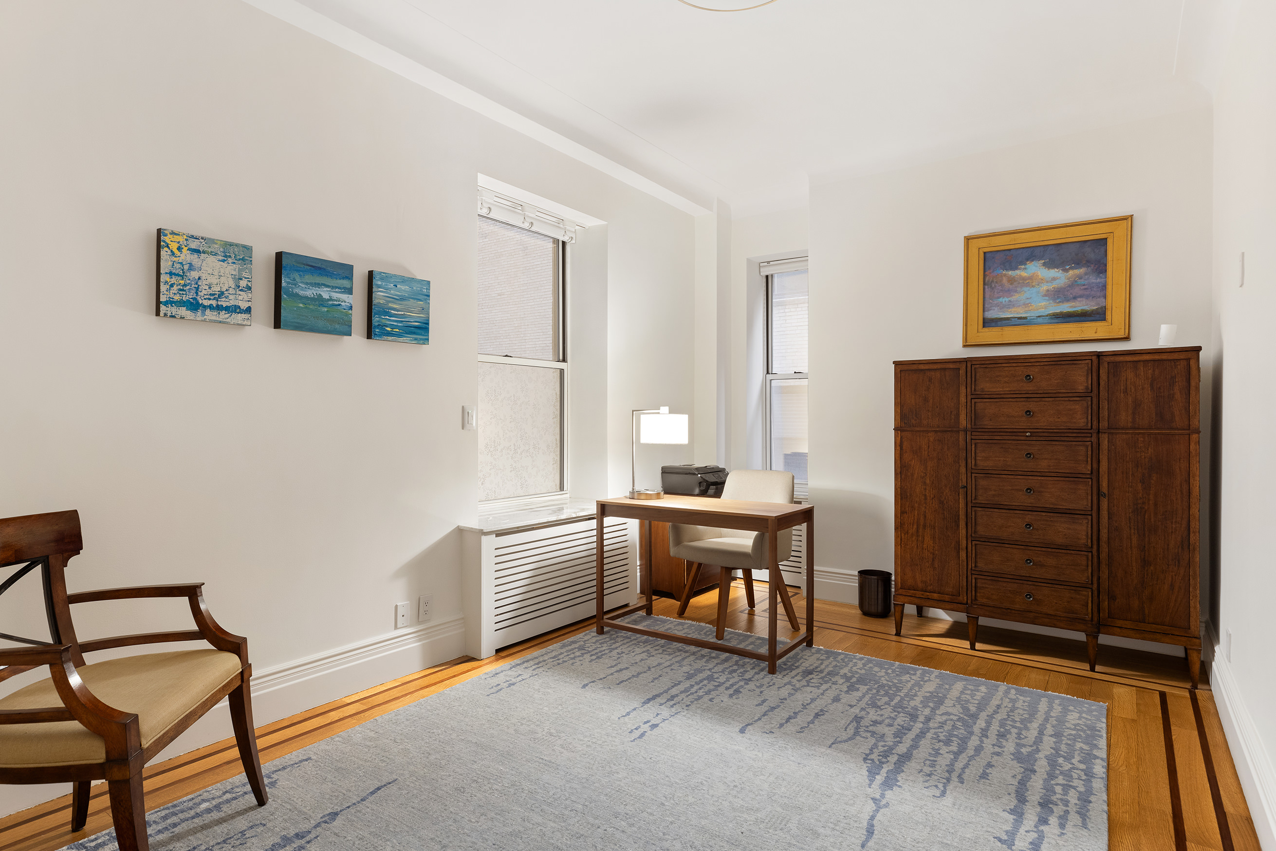 137 Riverside Drive, Unit 2D Manhattan, NY 10024 - Photo 8 of 20 a living room with furniture and a dresser