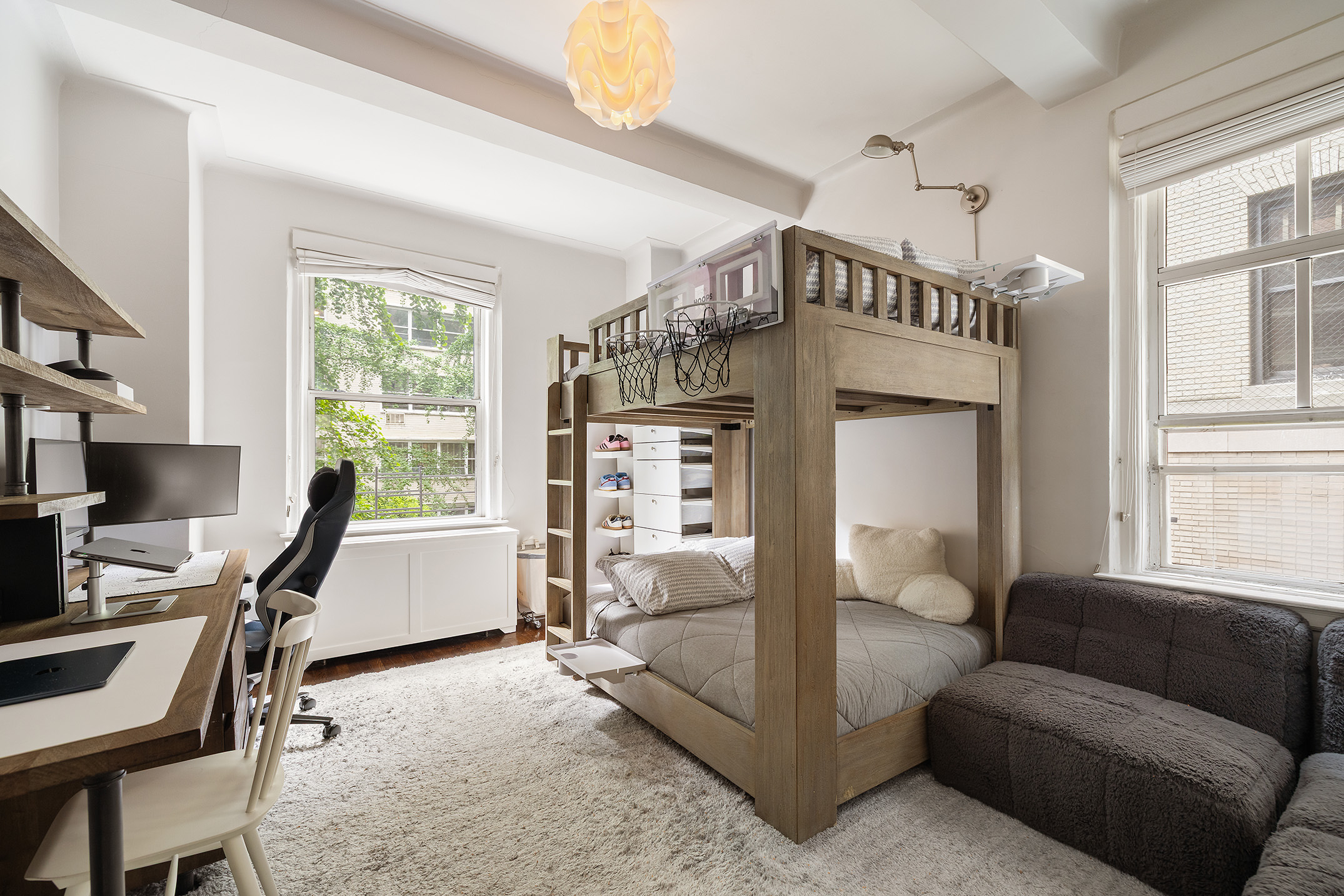 201 West 89th Street, Unit 2F Manhattan, NY 10024 - Photo 8 of 20 a living room with furniture a computer and a window