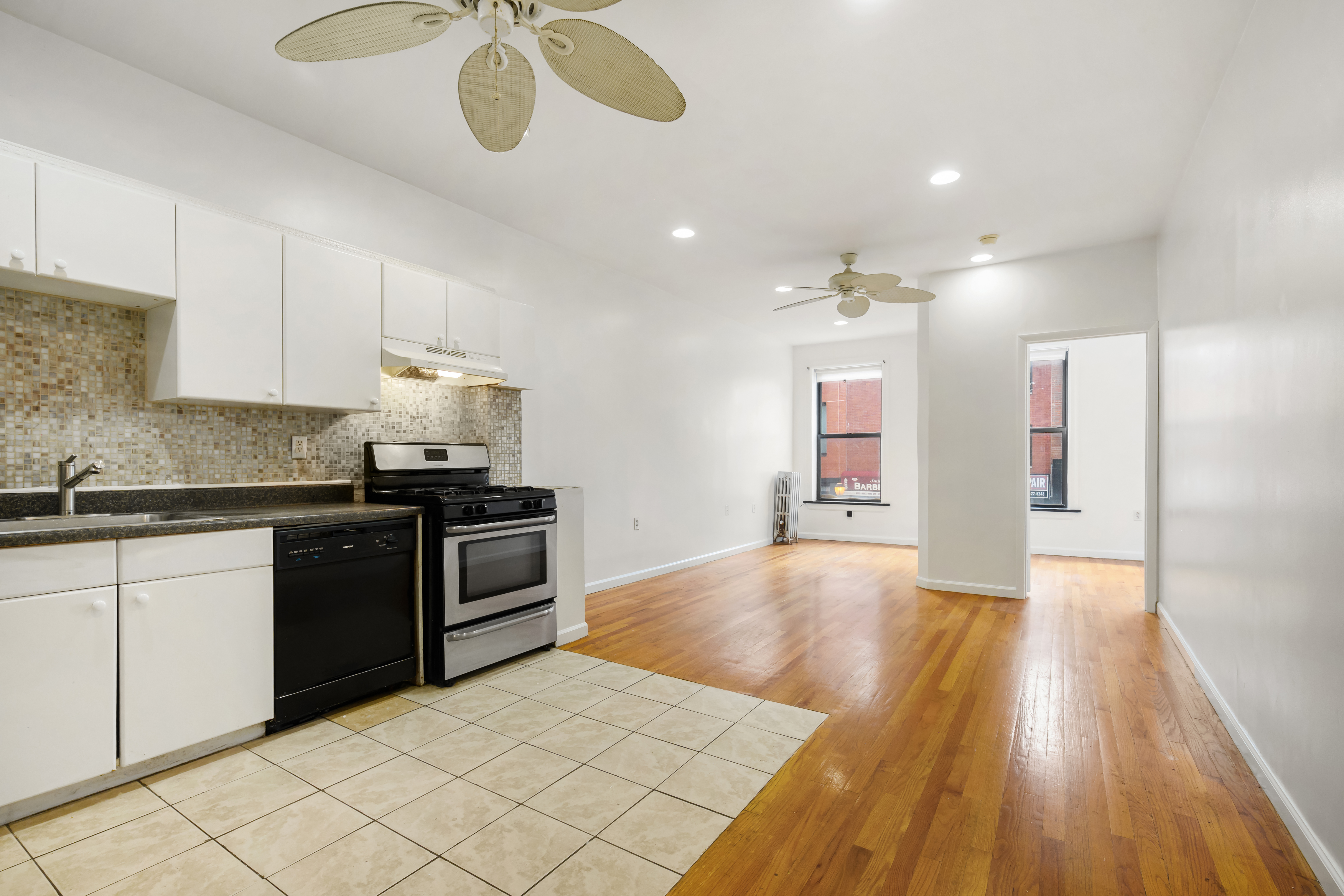 a kitchen with stainless steel appliances granite countertop a stove and a sink