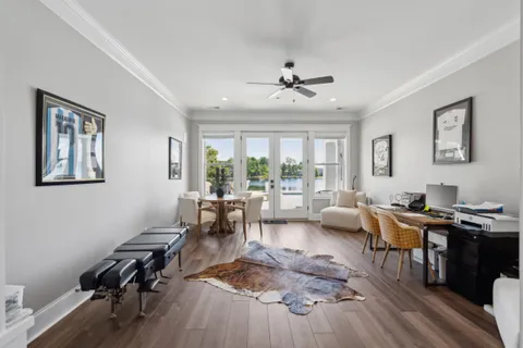 a roof deck with wooden floor and fence
