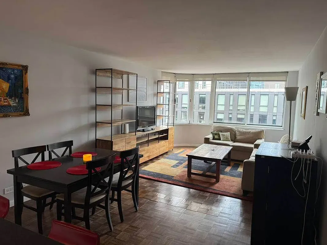 a living room with furniture and a window