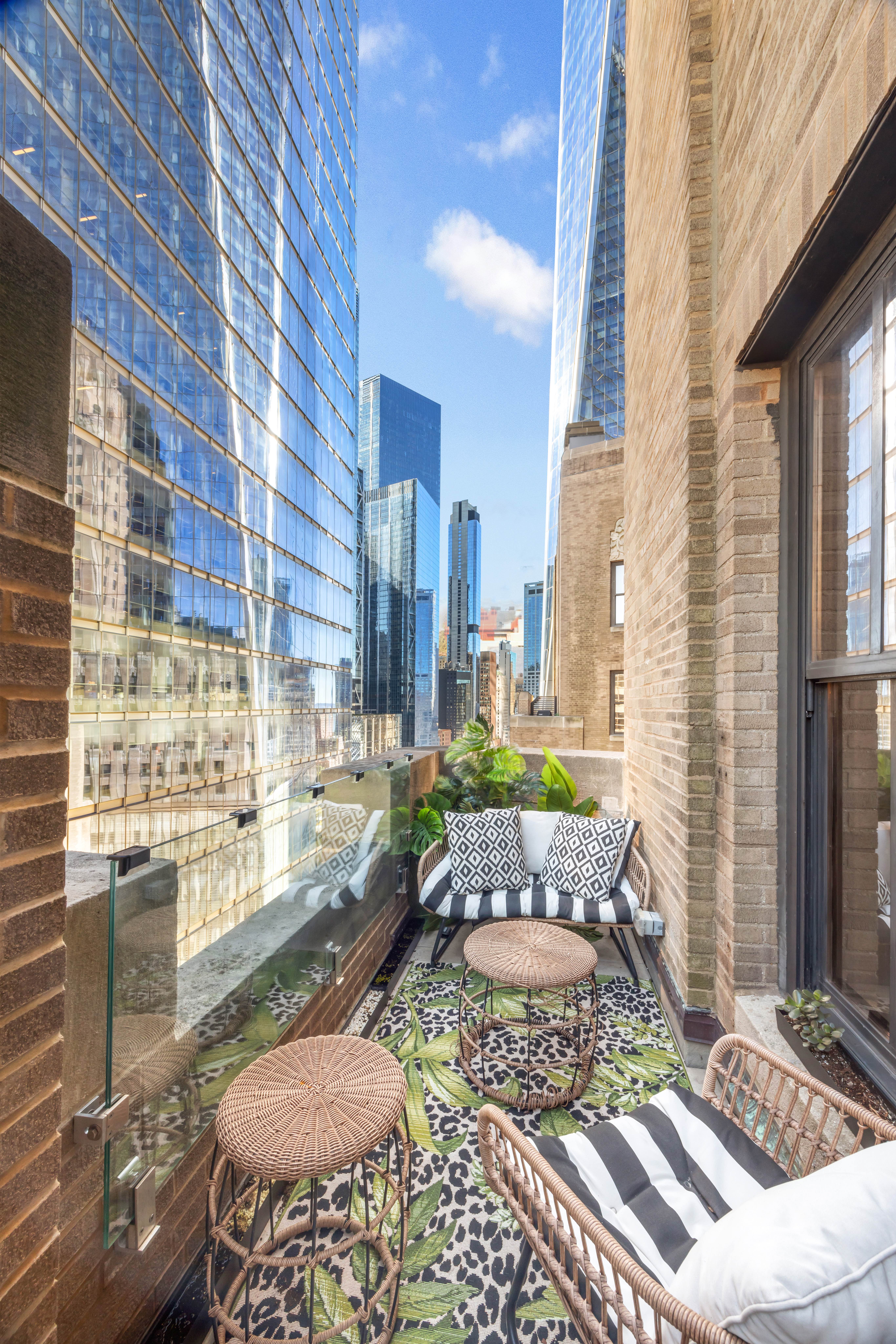 100 Barclay Street, Unit 16G Manhattan, NY 10007 - Photo 17 of 28 a building outdoor space with patio furniture