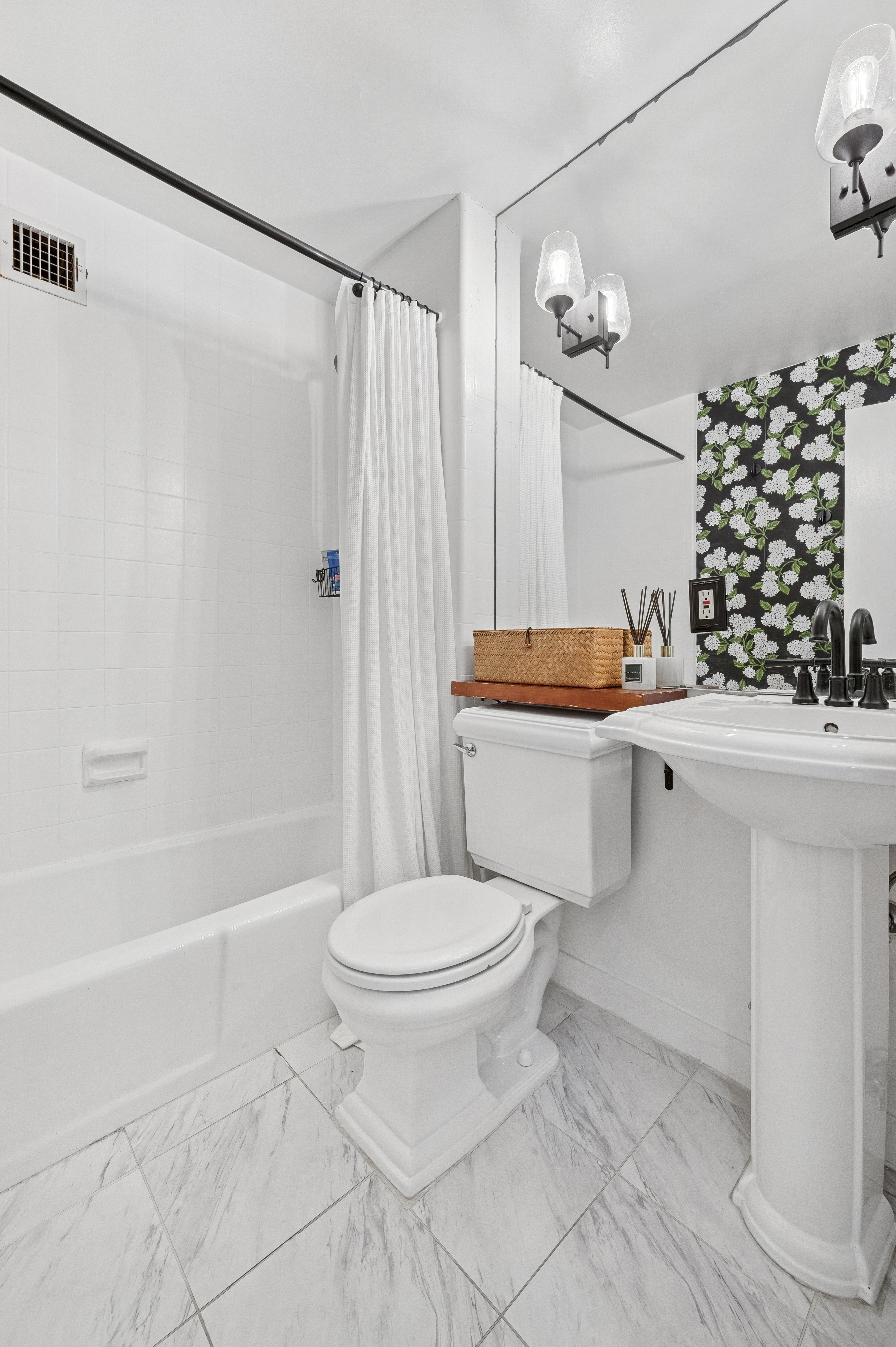 331 East 92nd Street, Unit 4B Manhattan, NY 10128 - Photo 5 of 7 a bathroom with a sink toilet and shower