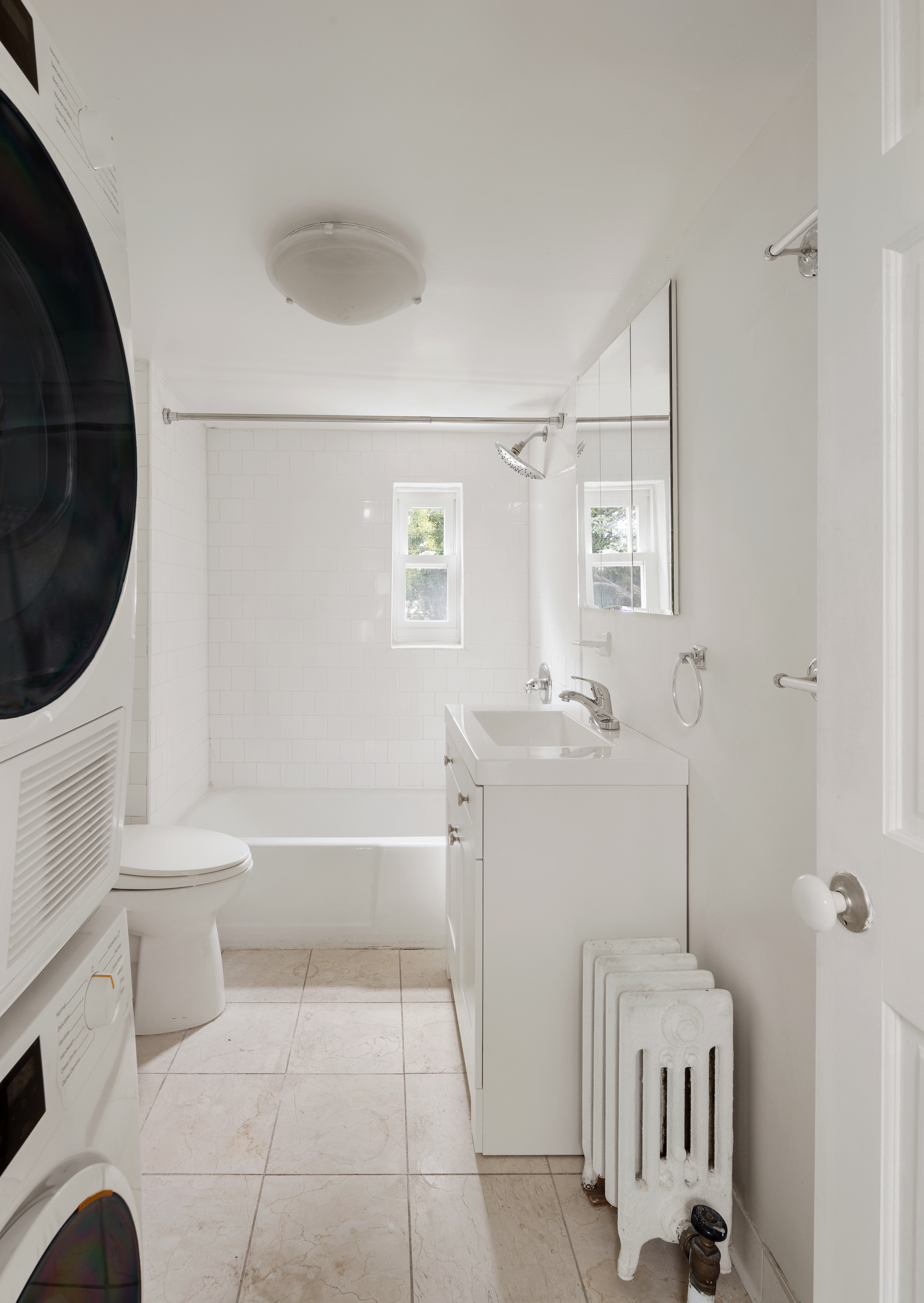 390 Pacific Street, Unit 2 Brooklyn, NY 11217 - Photo 5 of 10 a bathroom with a sink a toilet and bathtub