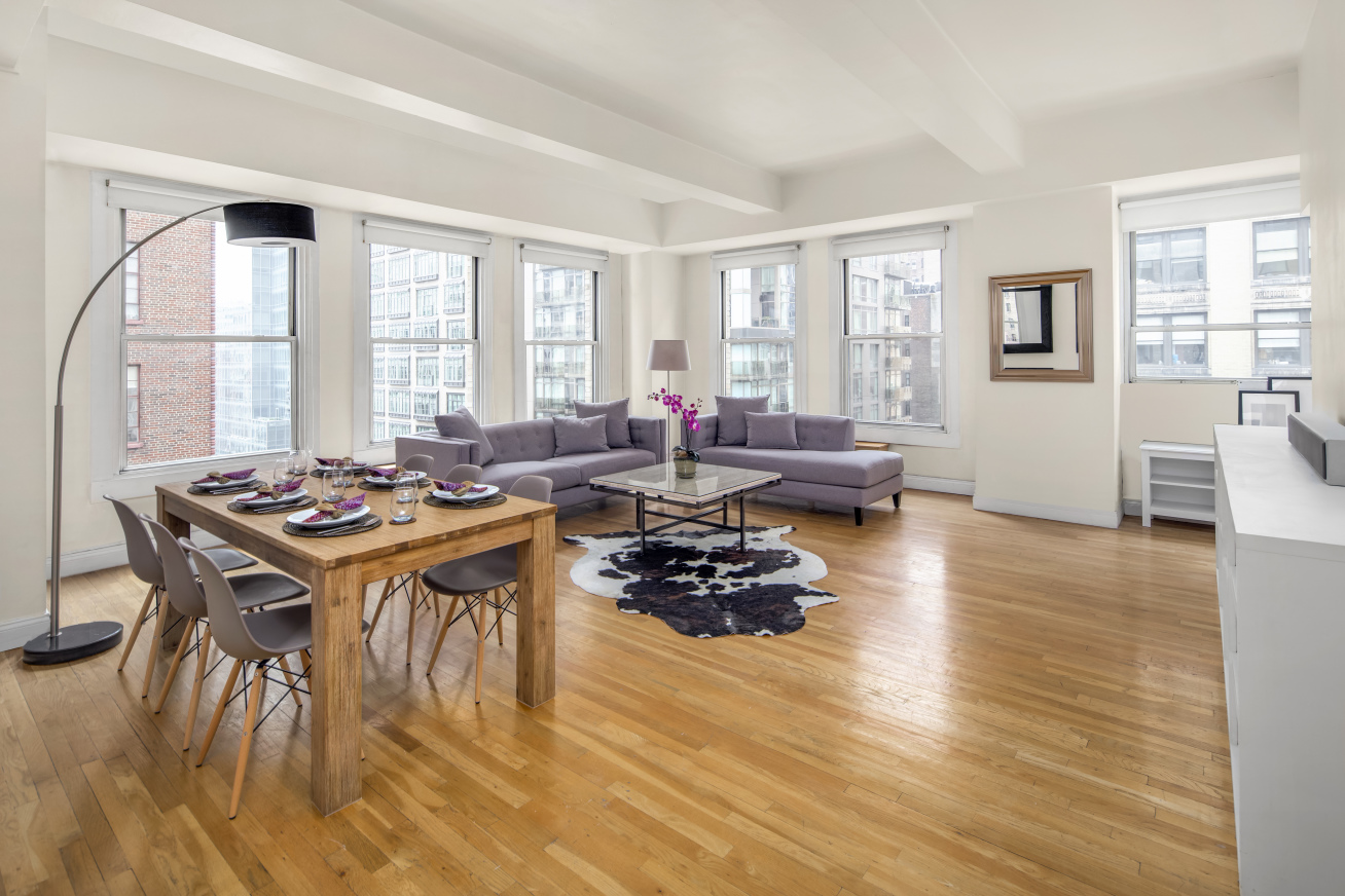 a living room with furniture and a large window