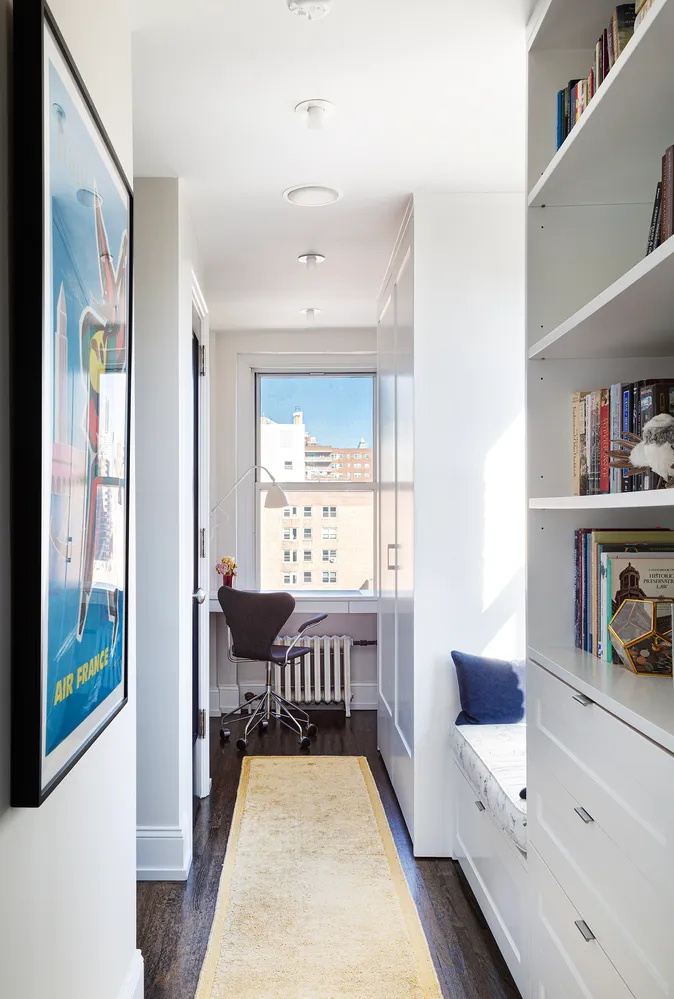 a view of a bedroom with furniture window and wooden floor
