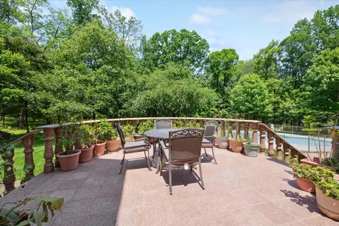a room with pool table and wooden floor