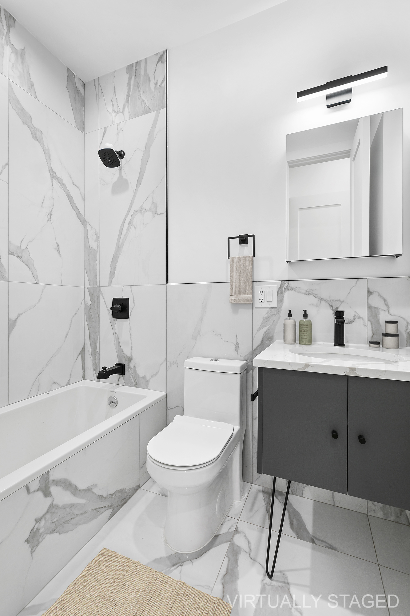 162 Cornelia Street, Unit 1 Brooklyn, NY 11221 - Photo 6 of 11 a bathroom with a sink toilet a mirror and bathtub