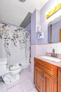 a bath room with a sink and a toilet