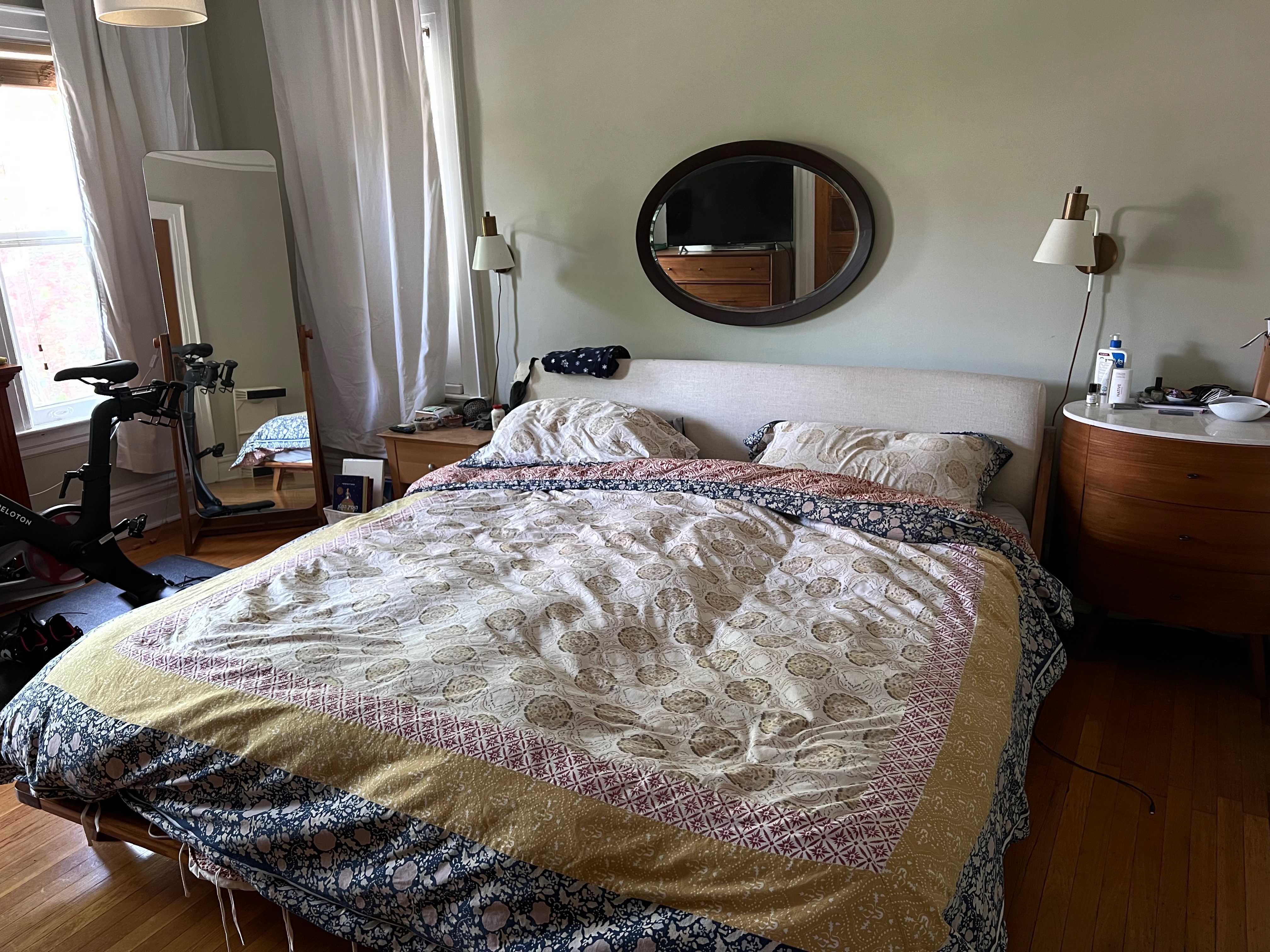 630 East 24th Street Brooklyn, NY 11210 - Photo 19 of 28 a bedroom with a bed and a dresser