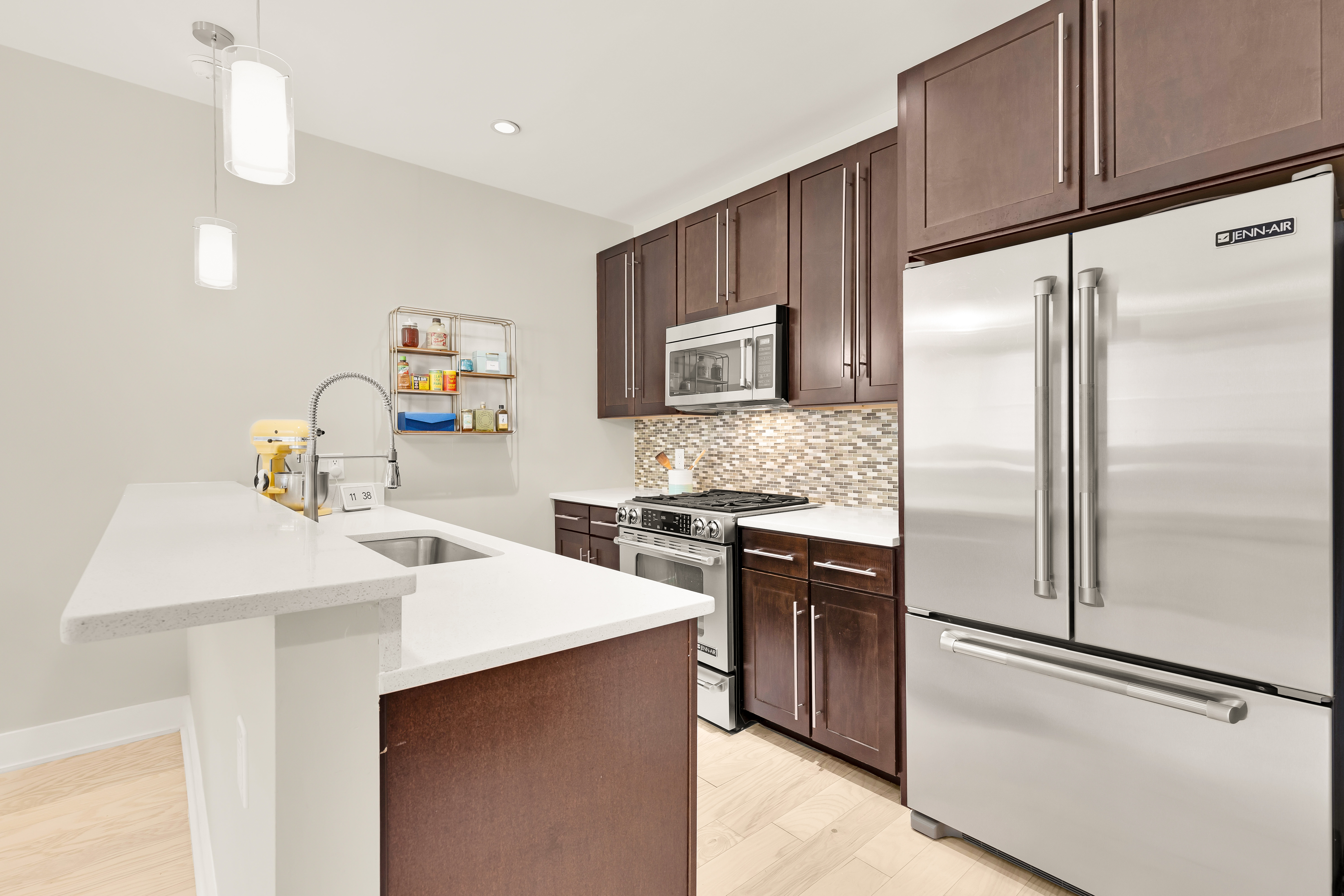 2101 11th Street Northwest, Unit 403 Washington, DC 20001 - Photo 10 of 30 a kitchen with a refrigerator sink and stove