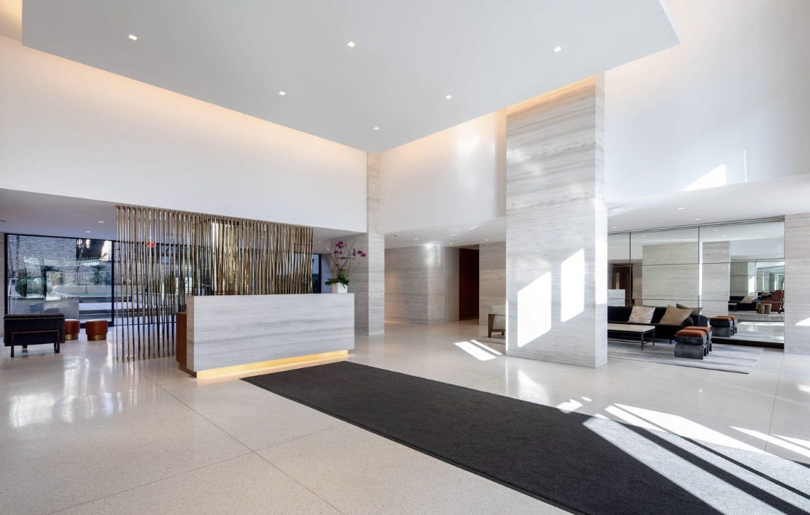 180 East End Avenue, Unit 15E Manhattan, NY 10128 - Photo 25 of 31 a lobby with furniture and a large mirror