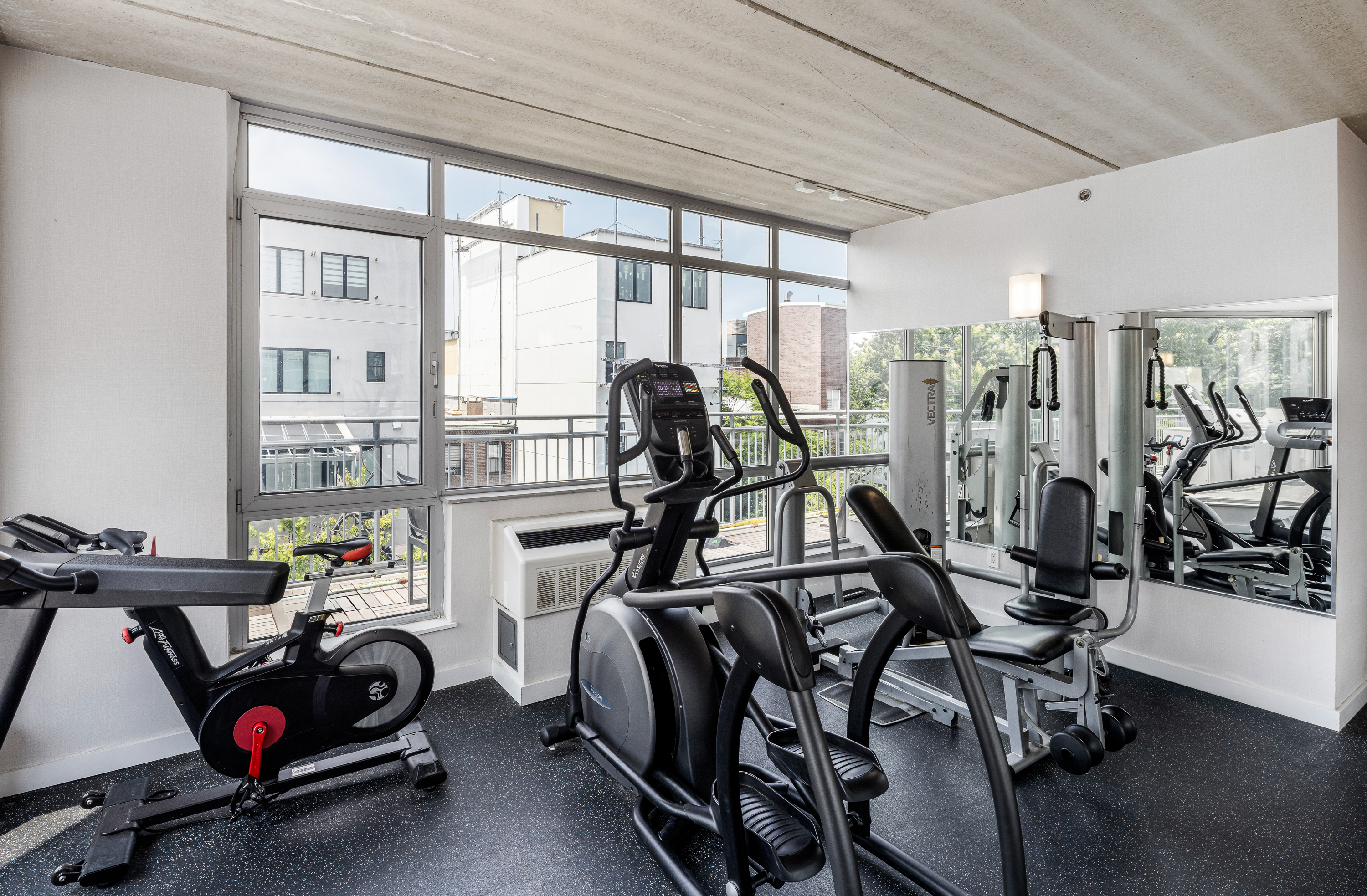 192 Spencer Street, Unit 1E Brooklyn, NY 11205 - Photo 11 of 13 a view of a room with gym equipment