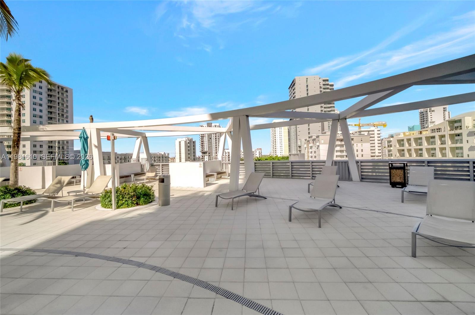 79 Southwest 12th Street, Unit 2201S Miami, FL 33130 - Photo 29 of 33 a building outdoor space with patio furniture and potted plants