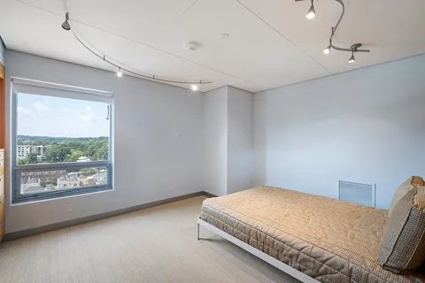 a living room with hard wood flooring and furniture