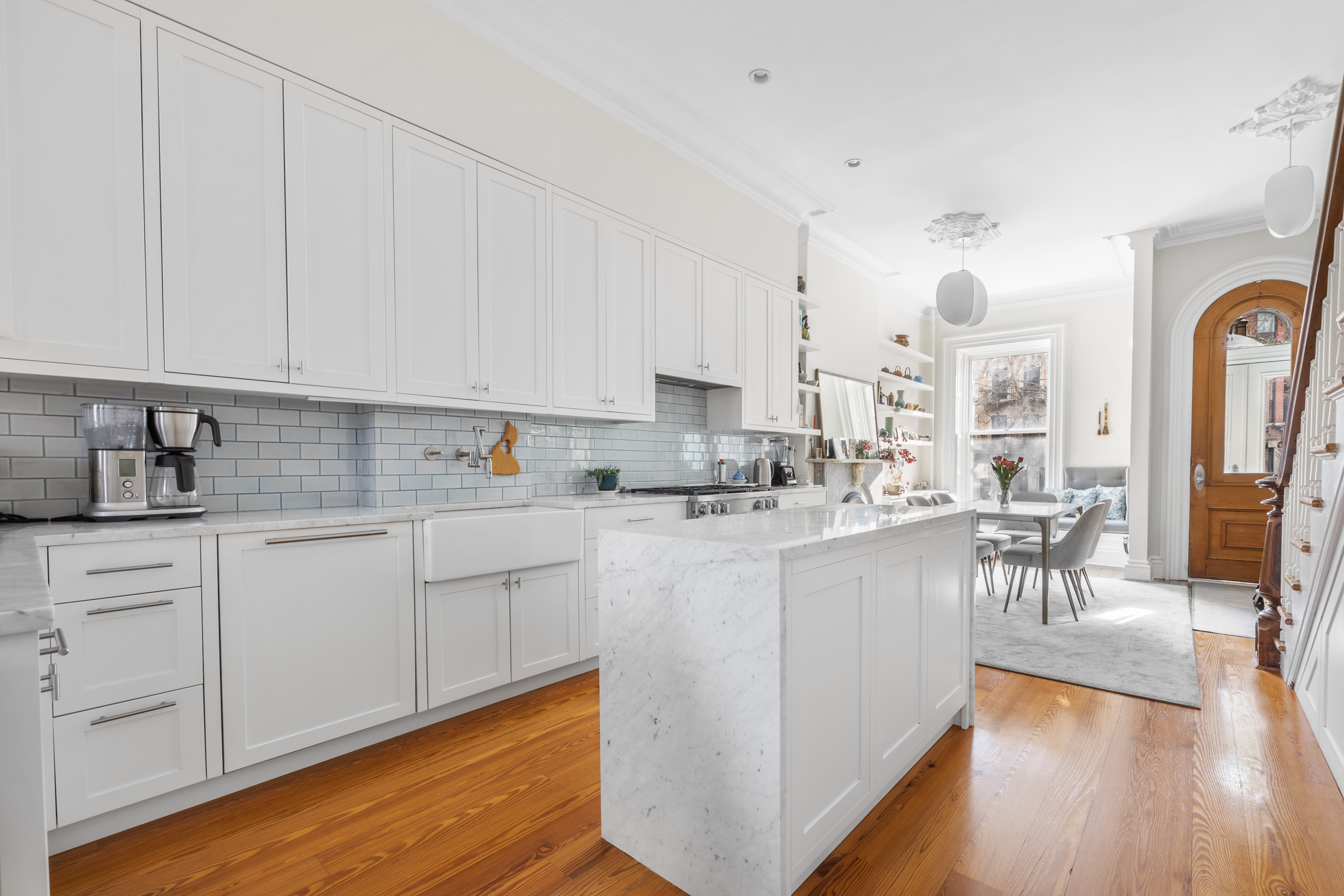 387 Union Street, Unit 2 Brooklyn, NY 11231 - Photo 2 of 12 a kitchen with stainless steel appliances granite countertop a stove a sink dishwasher and white cabinets with wooden floor