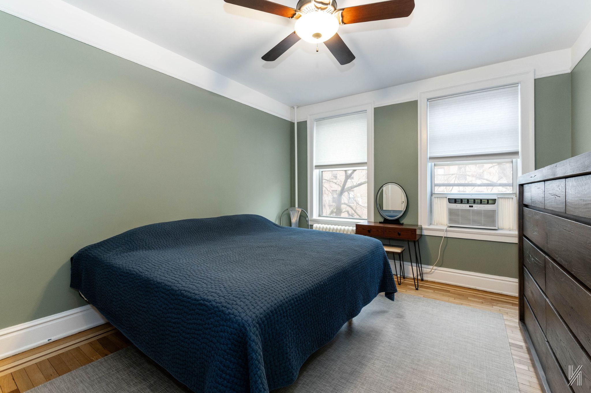 37-22 80th Street, Unit 31 Queens, NY 11372 - Photo 13 of 21 a bed room with a bed and a chandelier