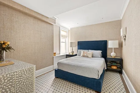 a bedroom with a bed and a table